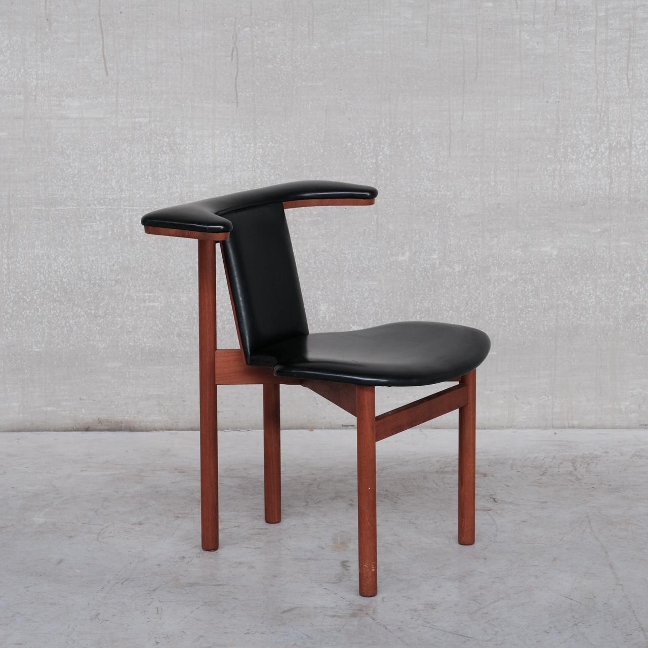 A stylish single desk chair. 

Likely Danish, c1960s. 

Leatherette and Teak. 

Remains in good condition, some scuffs and wear commensurate with age. 

Location: Belgium Gallery.

Dimensions: 60 W x 52 D x 45 Seat Height x 72 Total Height