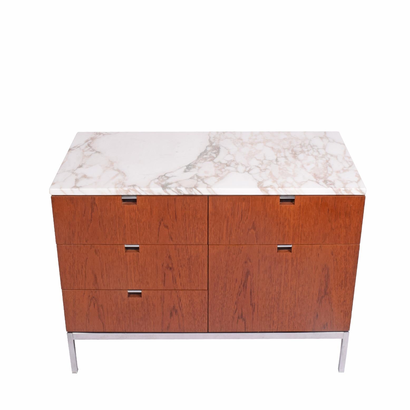 Iconic Florence Knoll design from the executive line, this teak five-drawer chest is freestanding, raised on chrome steel base. Dated 1972. Model 2542M.