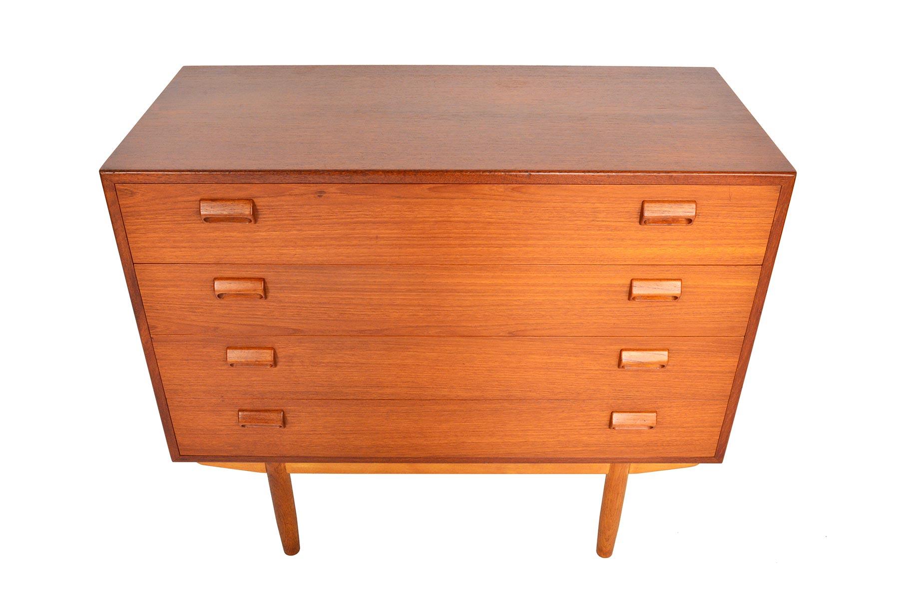 This beautiful gentleman’s chest was designed by Børge Mogensen for Søborg Møbelfabrik in 1951. The case is expertly crafted in teak and stands on a solid oak base. Each drawer front is adorned with the designer’s signature handles. Four deep