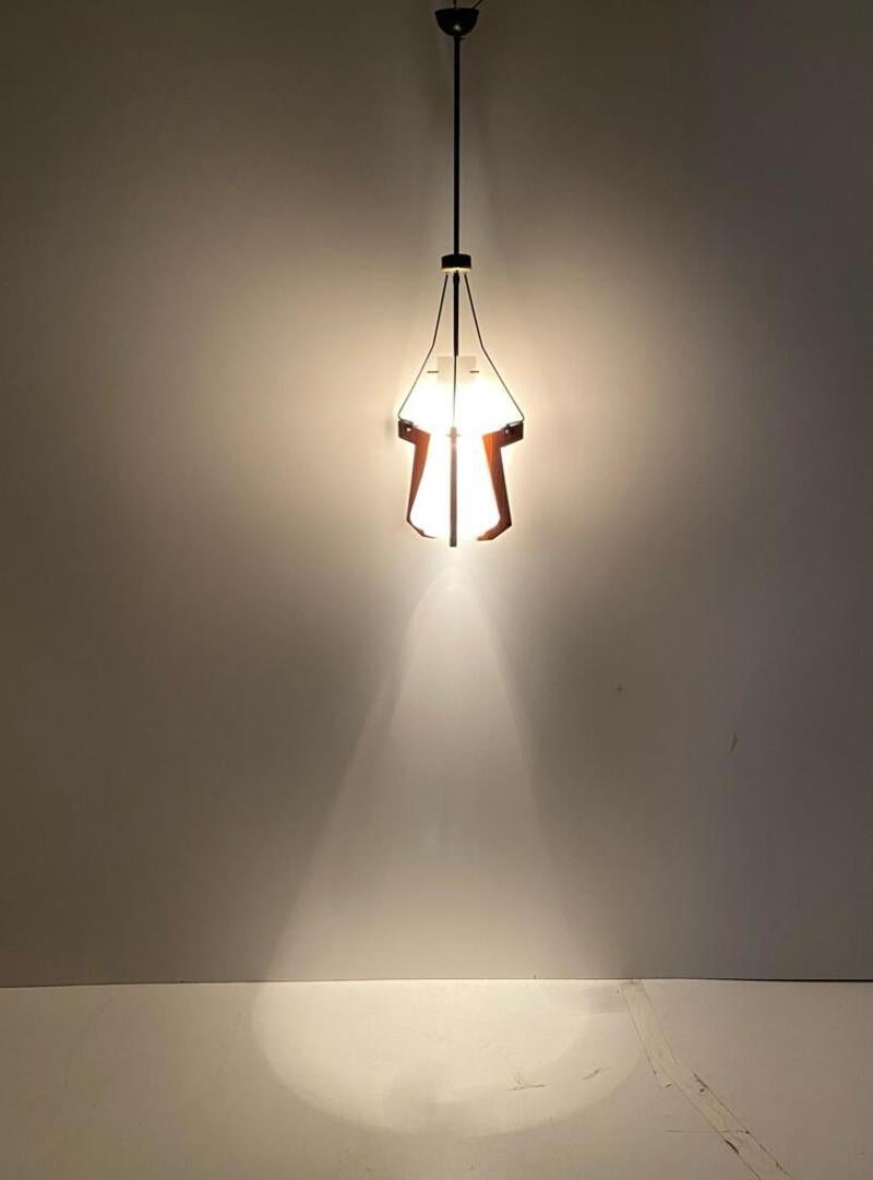 Vintage opaline pendant produced by Stilnovo and manufactured in Italy in the 1950s. 

Structure composed of a white-colored opaline glass shade anchored to the chandelier's iron frame and supported, at the bottom, by three teak wood supports.