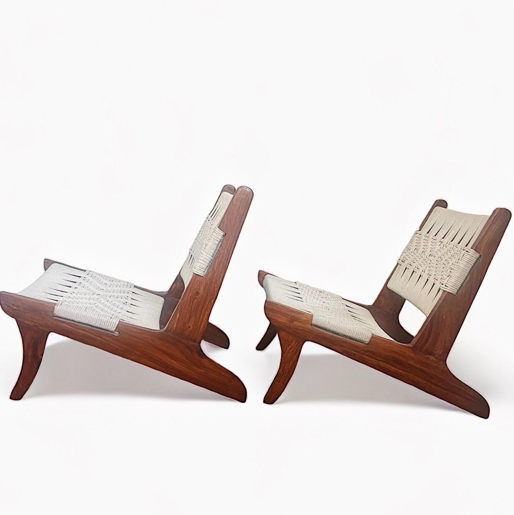 Fantastic pair of sculptural teak and rope low lounge chairs attributed to Pierre Jeanneret. These chairs were sourced from Chandigarh India in the early 2000s. These exact chairs appeared in Sothebys 20th Century Design, Lot 64, June 2015 along