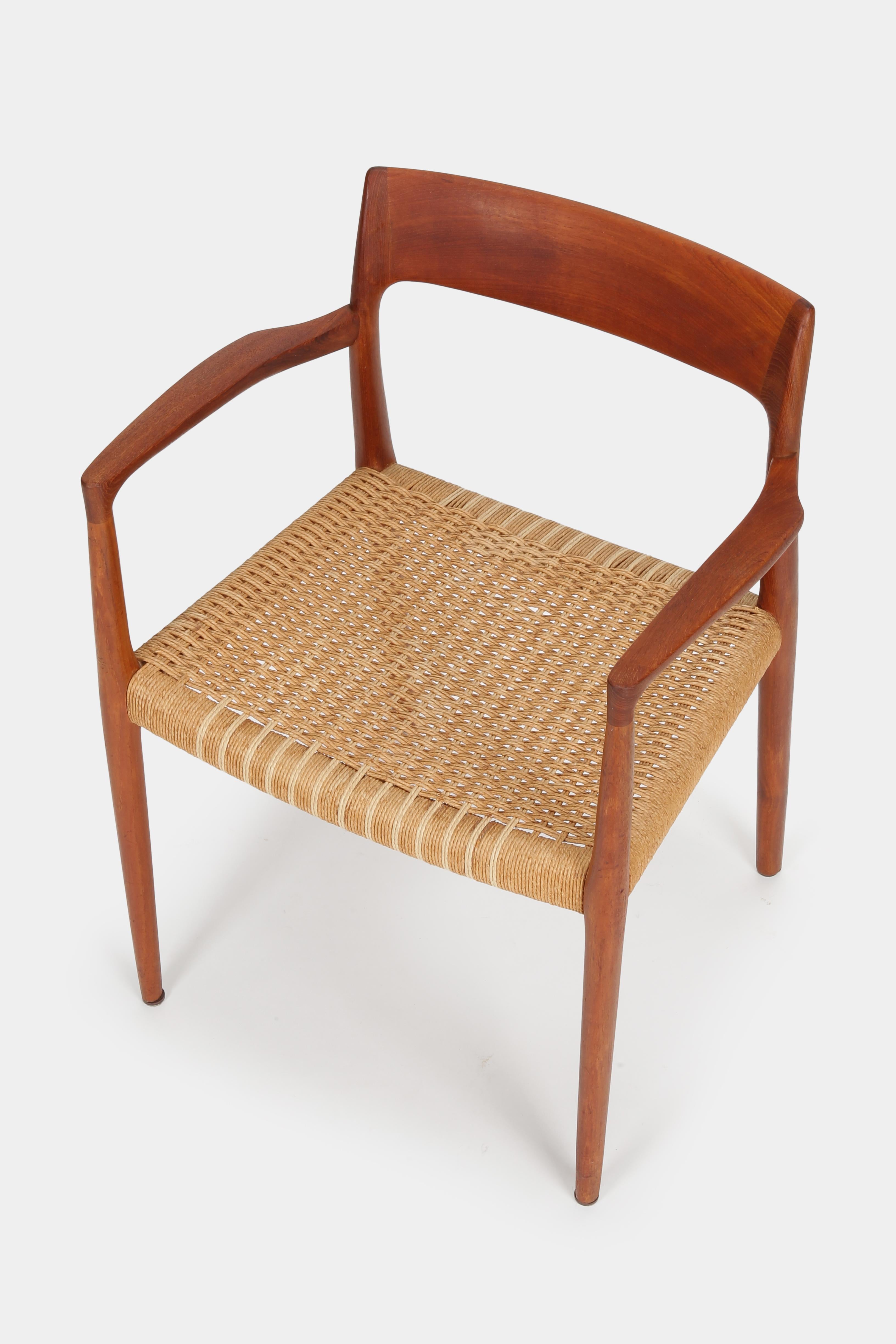 Elegant and comfortable armchair model 77 by Niels O. Møller from the 1960s. The frame is made of solid teak and the seat out of partially restored woven papercord. This chair would look great in any room and is in very good condition.