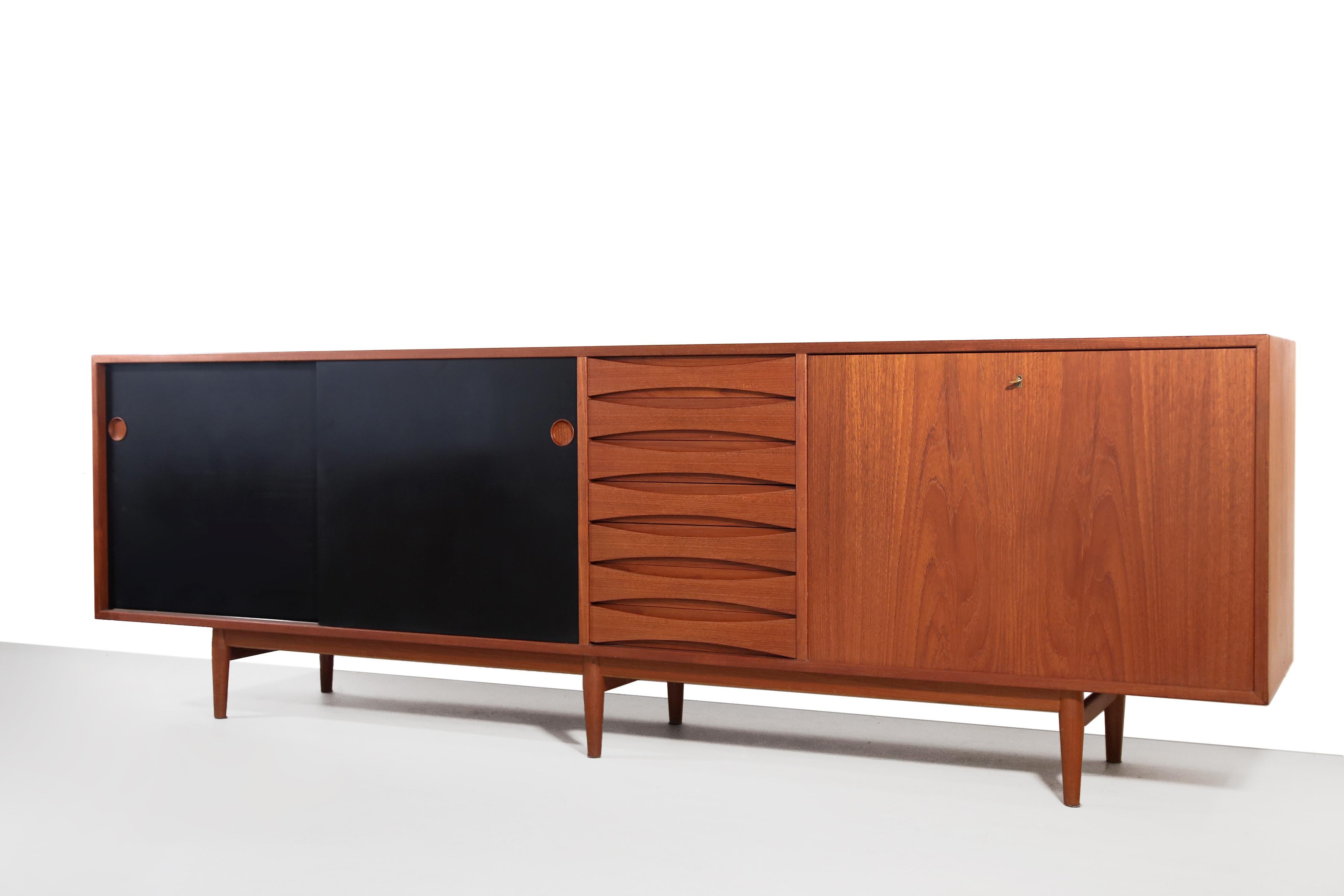 Very elegant sideboard designed by the great Danish designer Arne Vodder. Produced in the 1950s by Sibast, Denmark. This piece is of very high quality and very timeless due to the sleek minimalist design. The sideboard is made of teak and has two