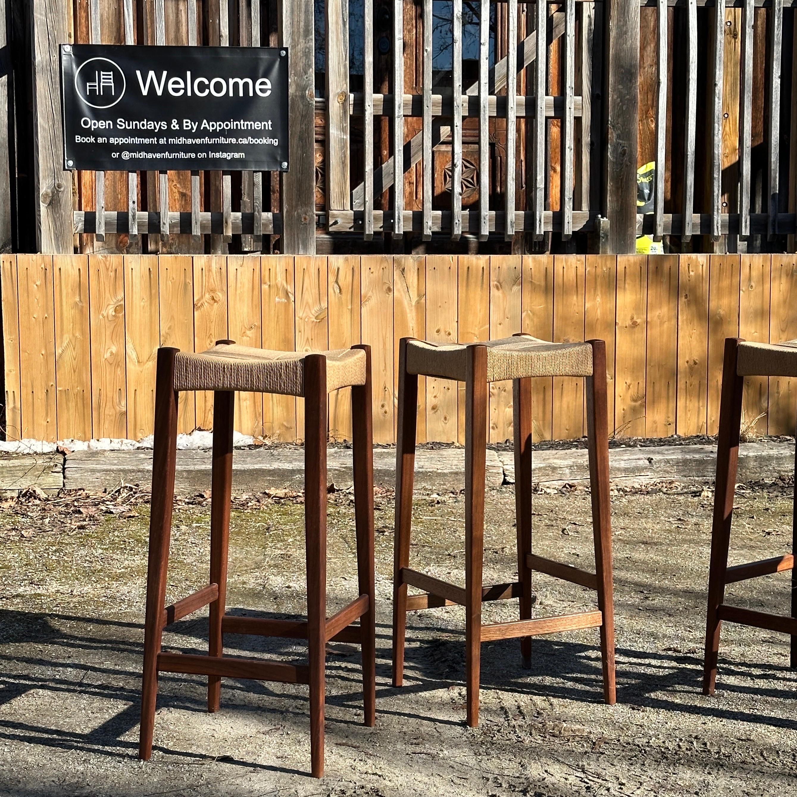 Condition: Great Vintage Condition - minor patina to paper cording

Dimensions: 14” L x 14” D x 30” H

Description: A vintage teak bar stool set, attributed to John Stene for Brunswick Manufacturing Company in Toronto, circa 1950s. Likely designed