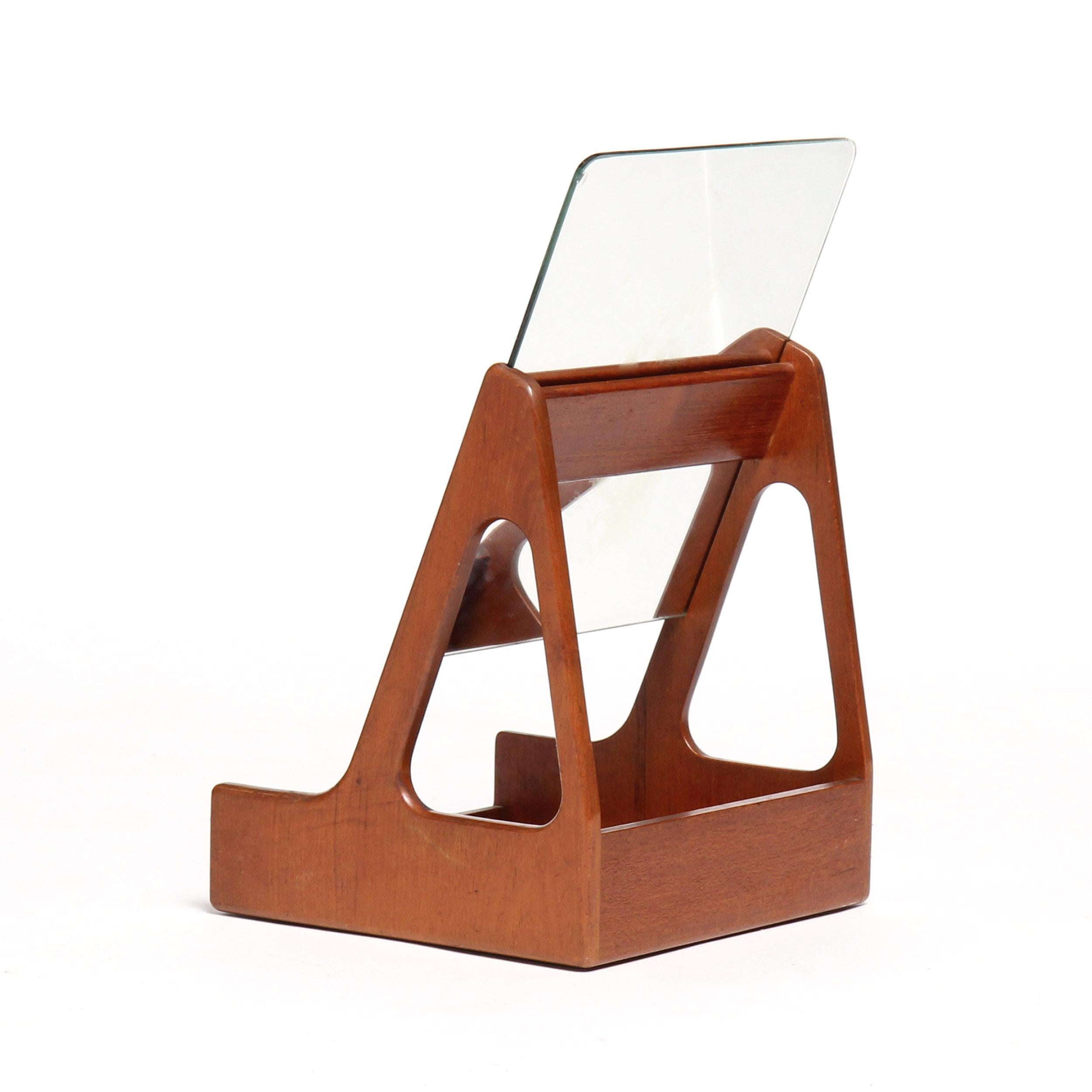 A simple teak beauty box with an open frame, slide-in mirror and a tray base.