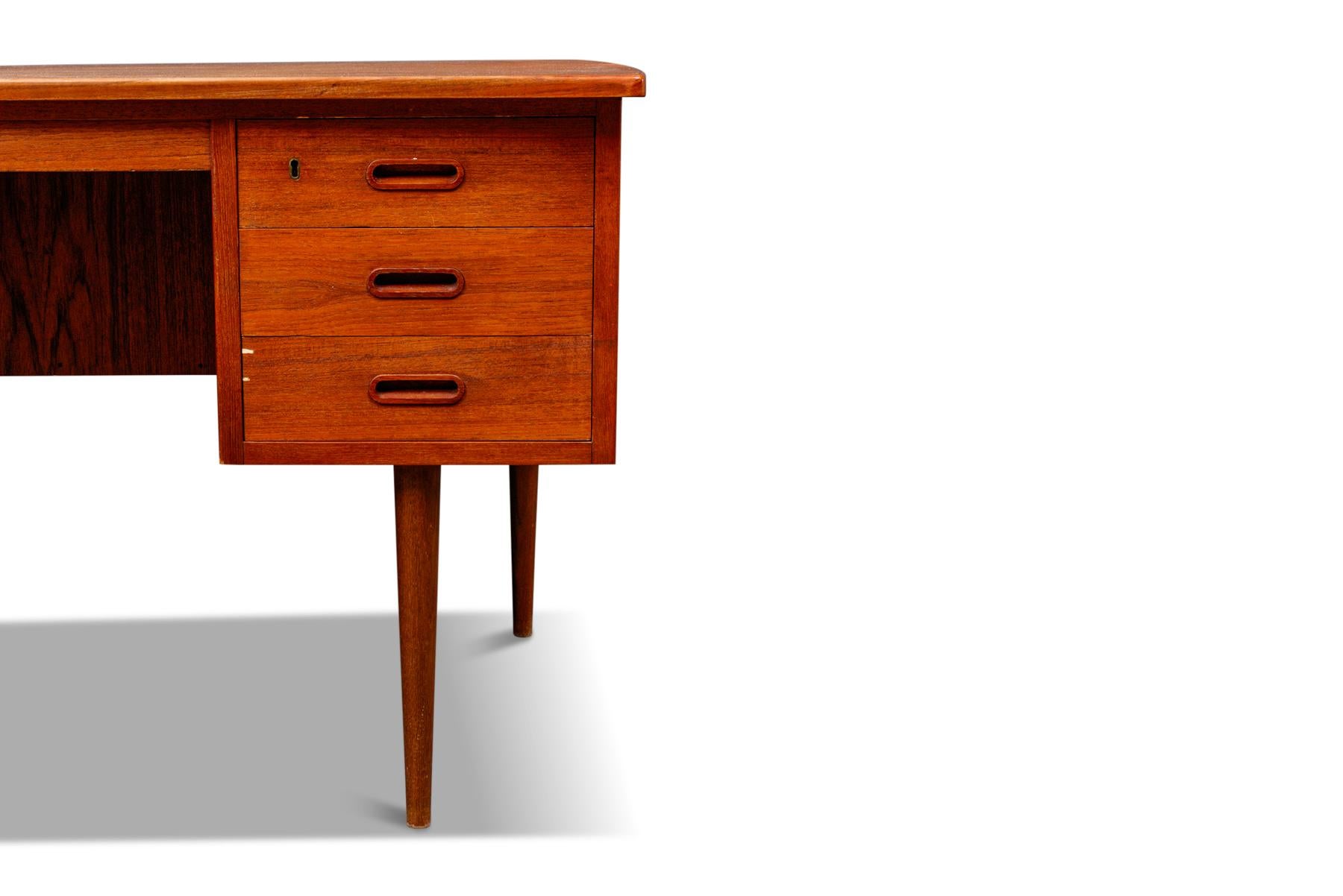 Origin: Denmark
Designer: Unknown
Manufacturer: Unknown
Era: 1960s
Materials: Teak
Measurements: 53? wide x 29? deep x 29? tall

Condition:
In excellent original condition with light cosmetic wear. Price includes refinishing.