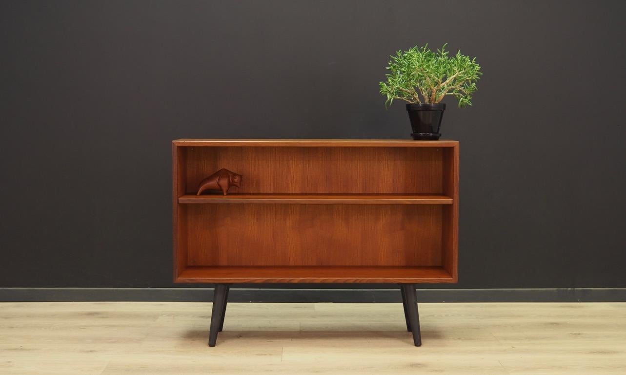 Classic bookcase / library from the 1960s-1970s, Scandinavian minimalism. The surface of the furniture finished with teak veneer. Shelf with adjustable height. Maintained in good condition (minor bruises and scratches), directly for