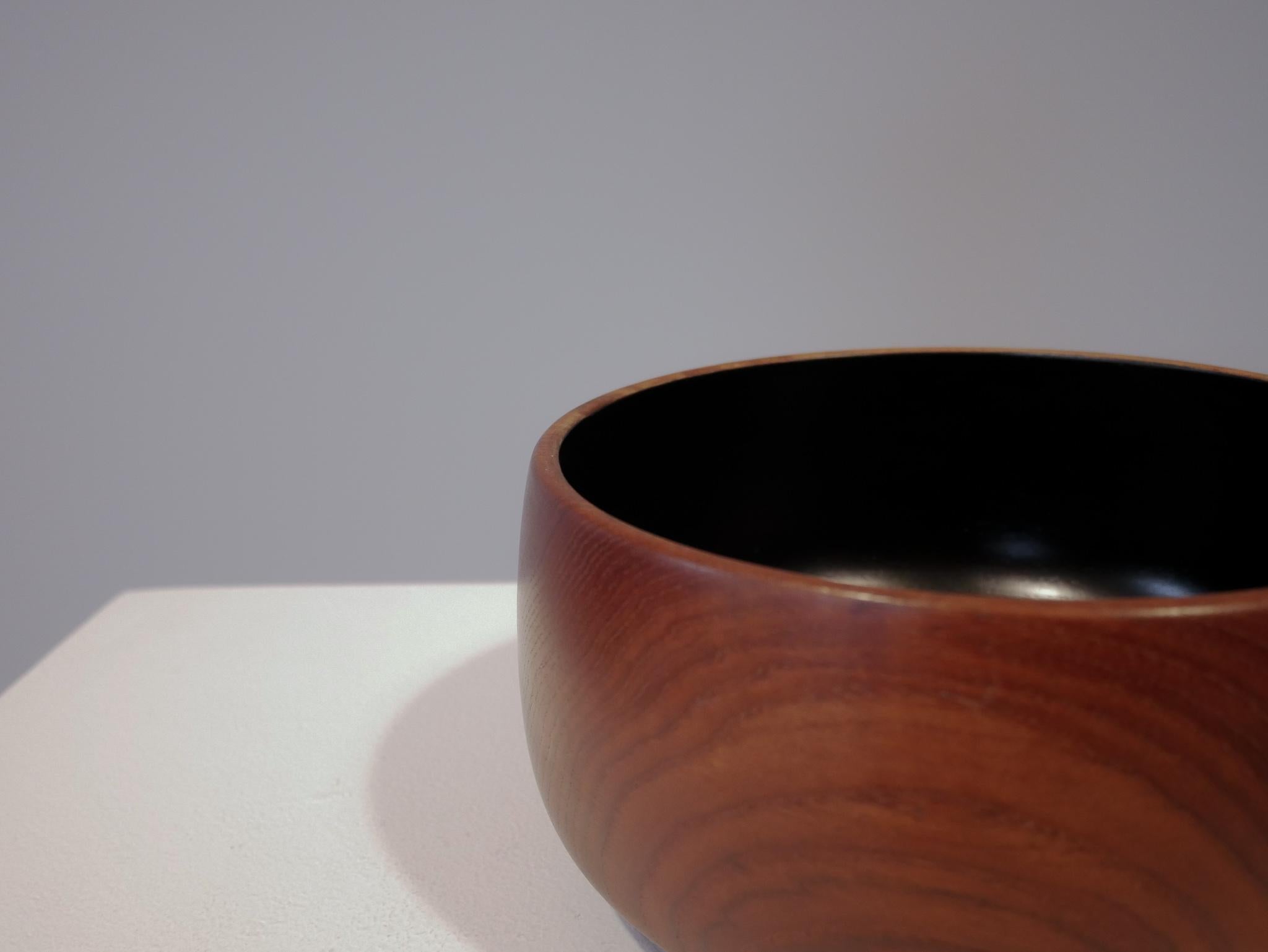 Amazing teak bowl from Denmark with black lacquered inside.