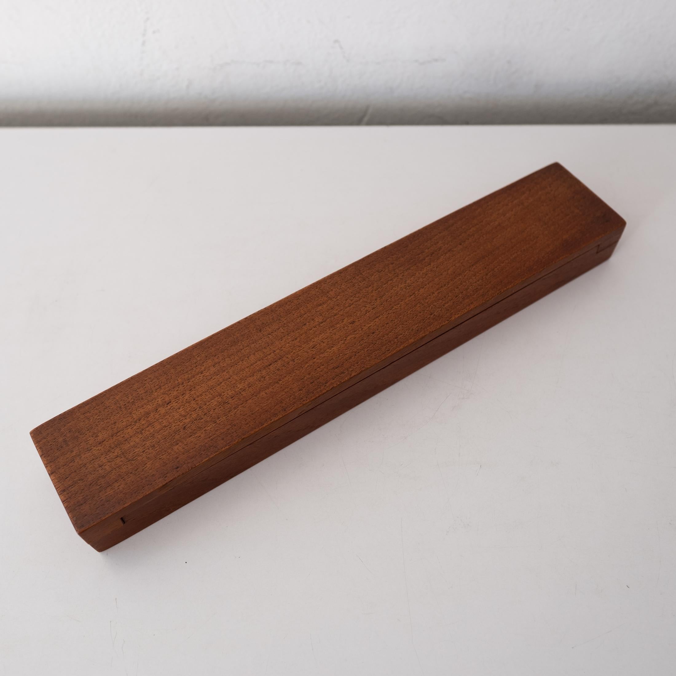 A hard to find early Dansk teak box designed by Jens Quistgaard. It has removeable dividers. Could be used for jewelry, watches, earrings or ?? Stamped on the bottom. Made in Denmark, 1960s.