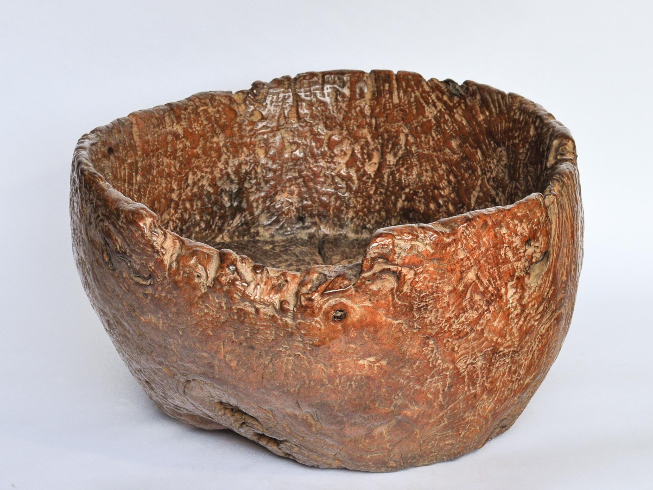 Large Teak burl wood planter / Bowl with eroded bottom, from Madura, Java, Early to Mid-20th Century.
This beautiful rustic bowl is fashioned from a large single piece of rugged teak burl. Madura Island, just off the northeast coast of Java is