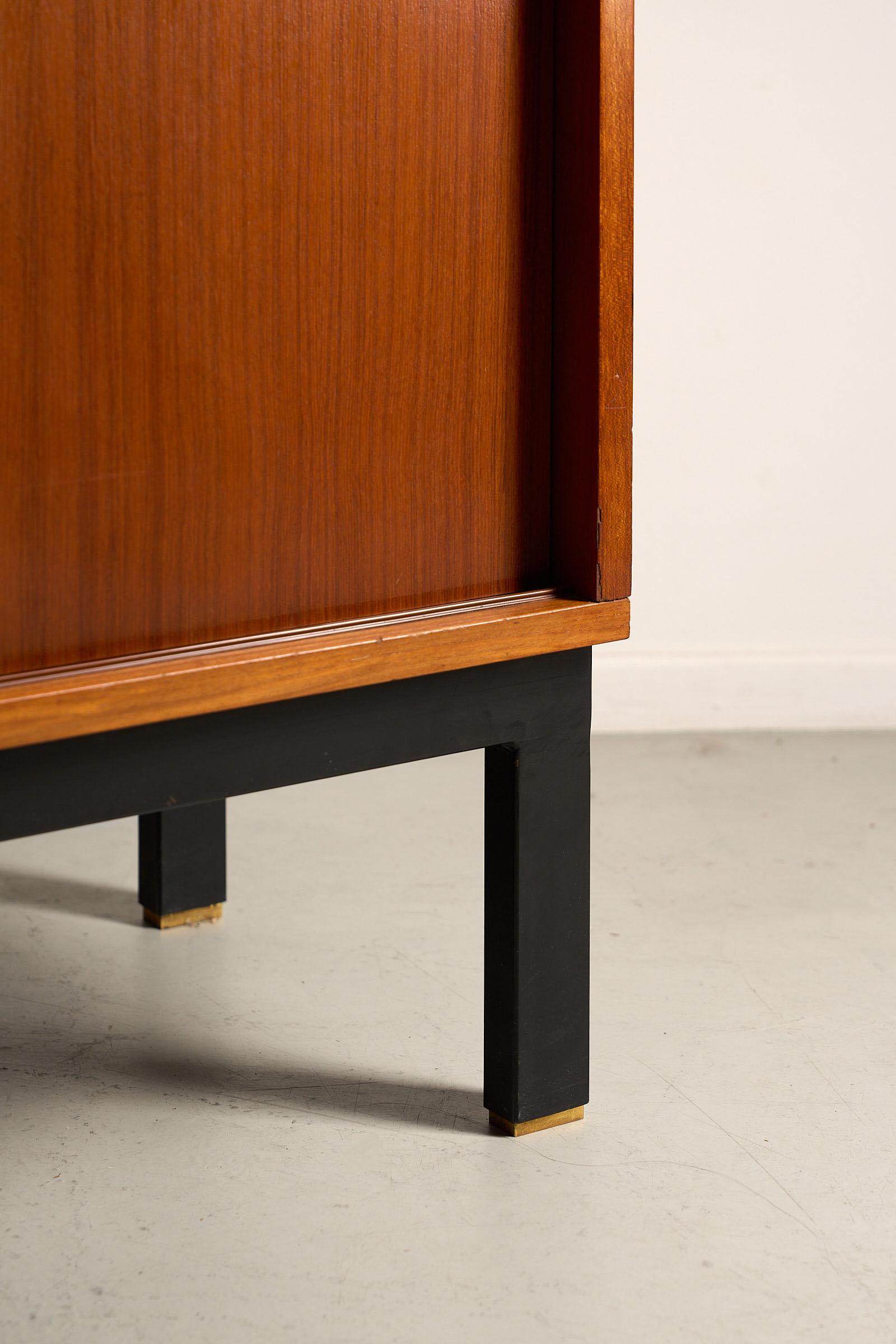 Italian Teak cabinet with brass details & black metal base, 1970s For Sale
