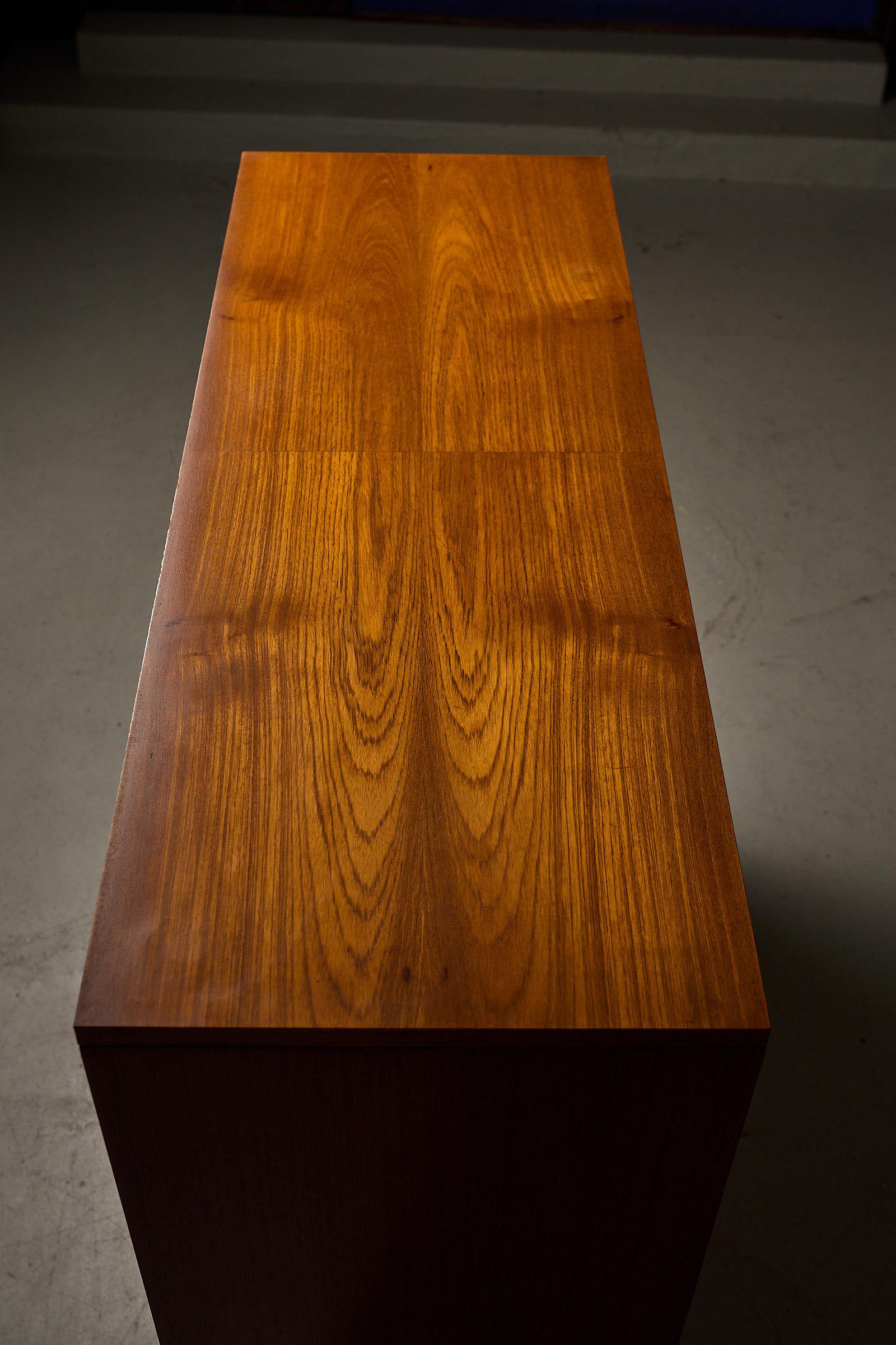 Late 20th Century Teak cabinet with brass details & black metal base, 1970s For Sale
