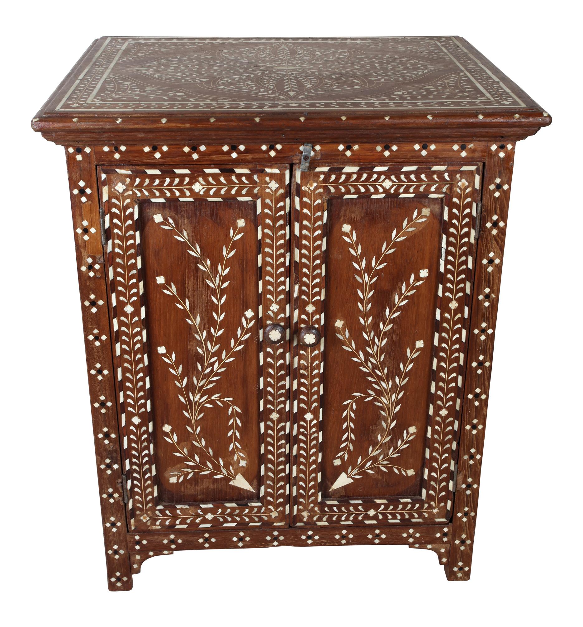 Teak cabinet with bone inlay in a very intricate pattern. Incredible, fine workmanship. Interior shelves, India, mid-1900s.  Inlay along side borders as well.  interior shelves and cubbies.  