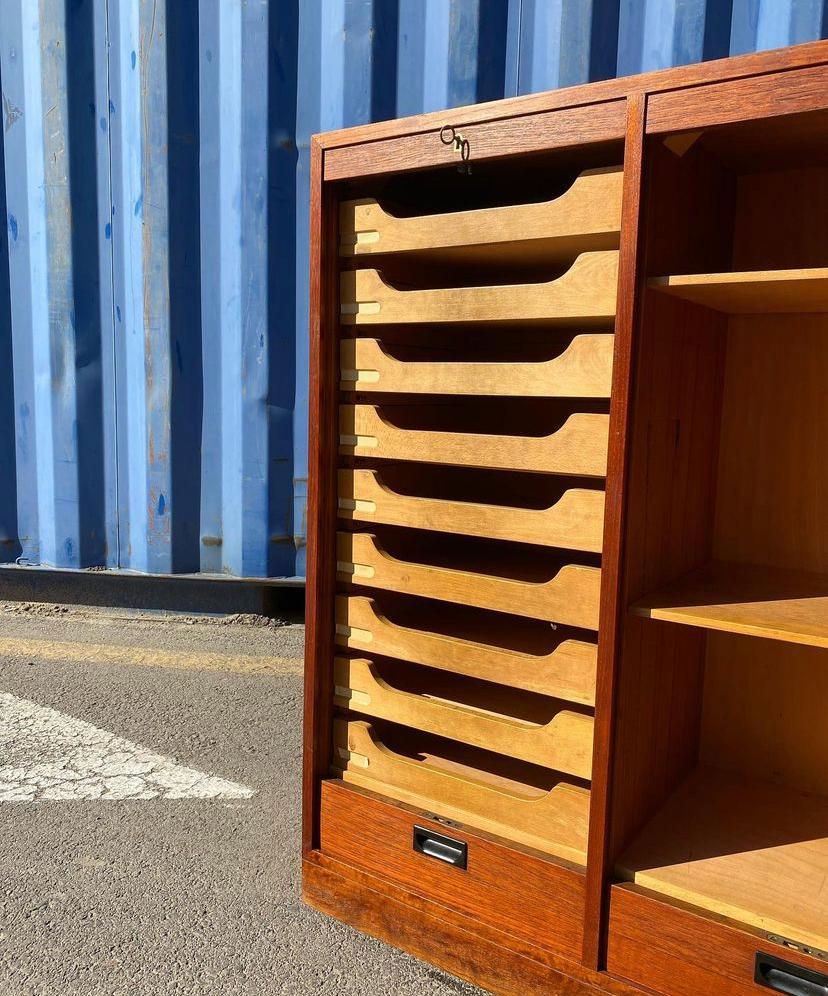 MCM Danish modern double filing cabinet with vertical sliding tambour front in teak made by Bjerringbro Savværk in the 1960s, Denmark.

Two separate compartments, one with 9 drawers and one with two height adjustable shelves. Drawers in solid
