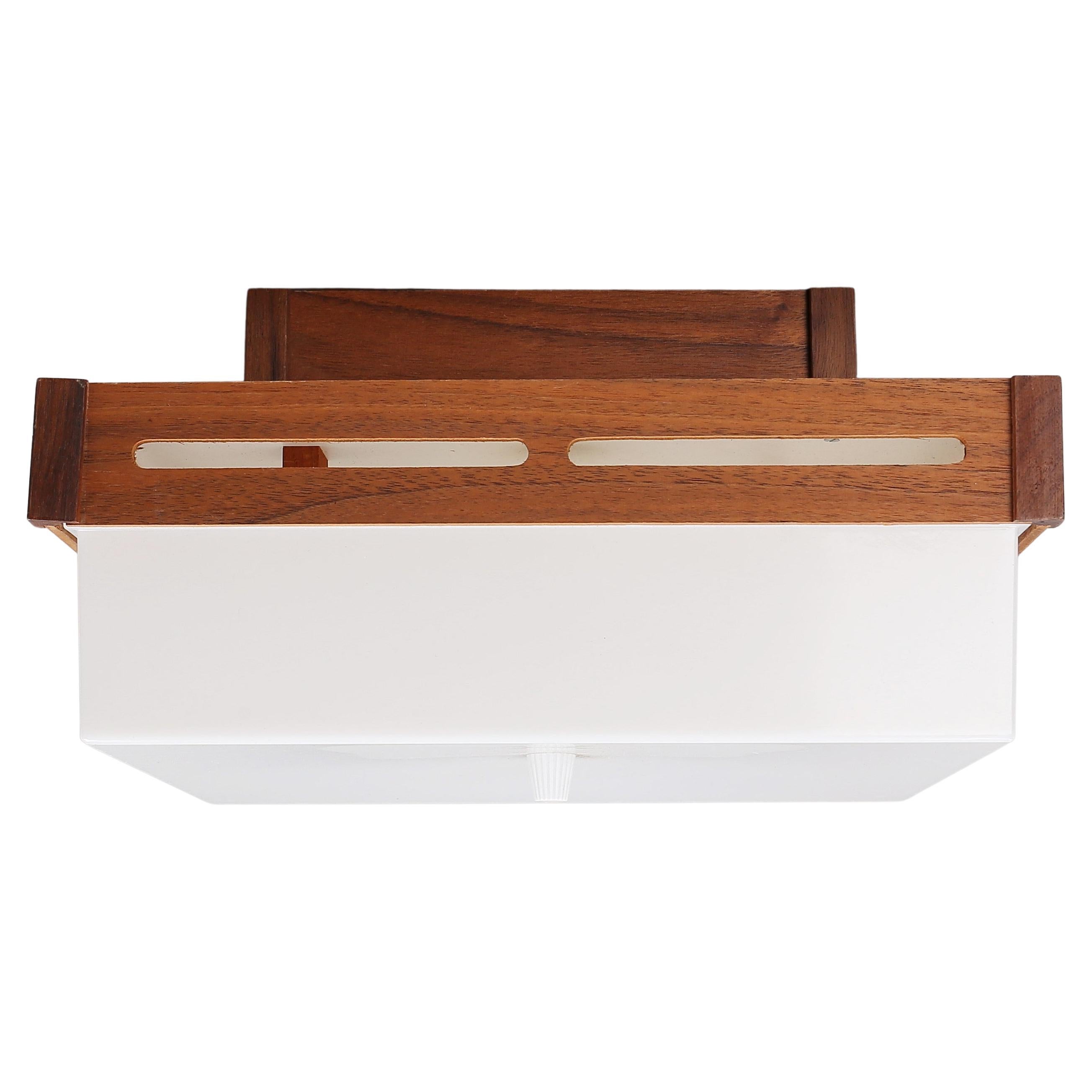 A Teak ceiling lamp Anonymous made in Sweden around 1960s.
White acrylic shade mounted on a teak base with nice details.
Normal wear and tear.