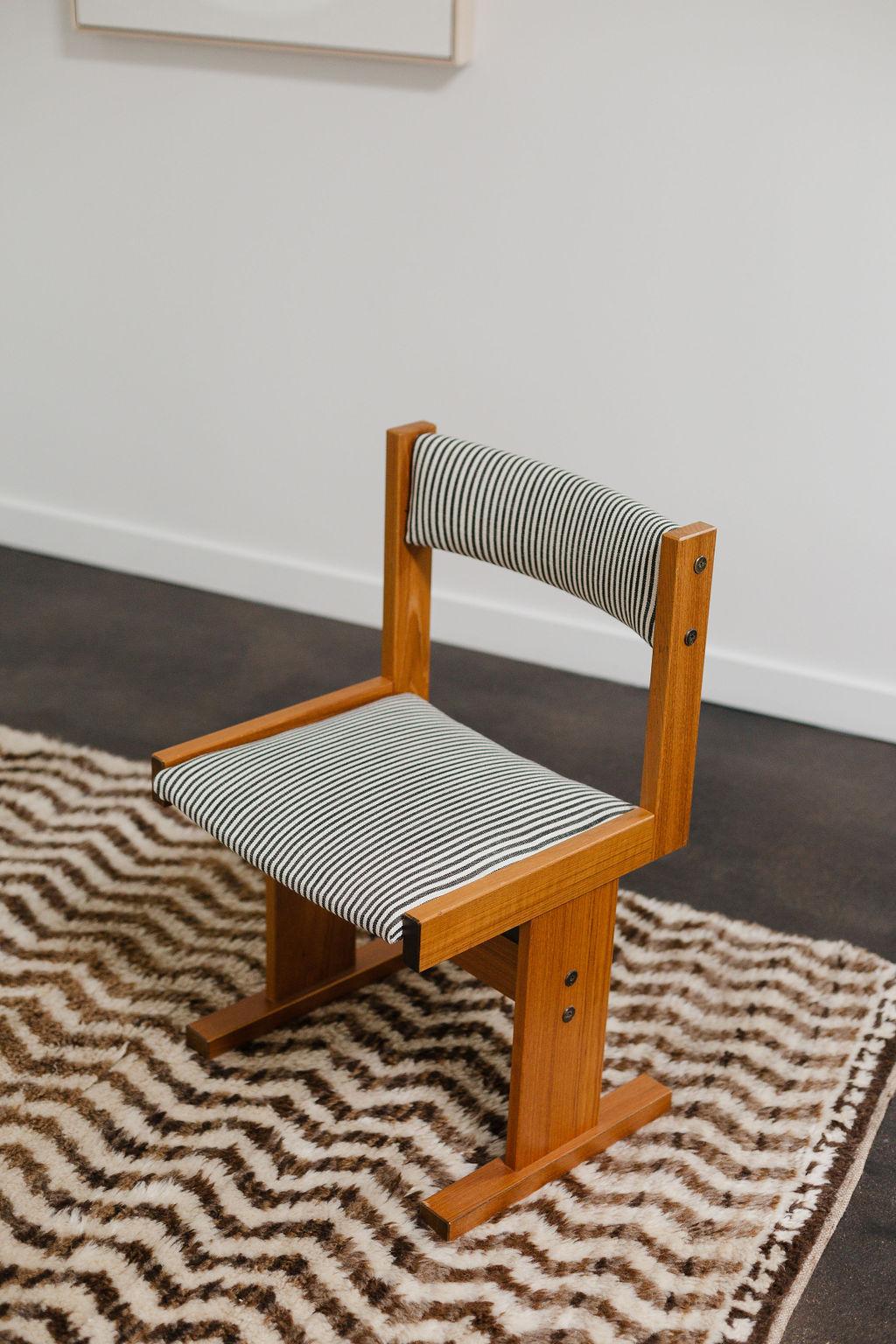 This teak chair by Paul Poulsen for Gangsø Møbler has been restored and refinished by the Selby House in a Perennials, Rose Tarlow tatton stripe.