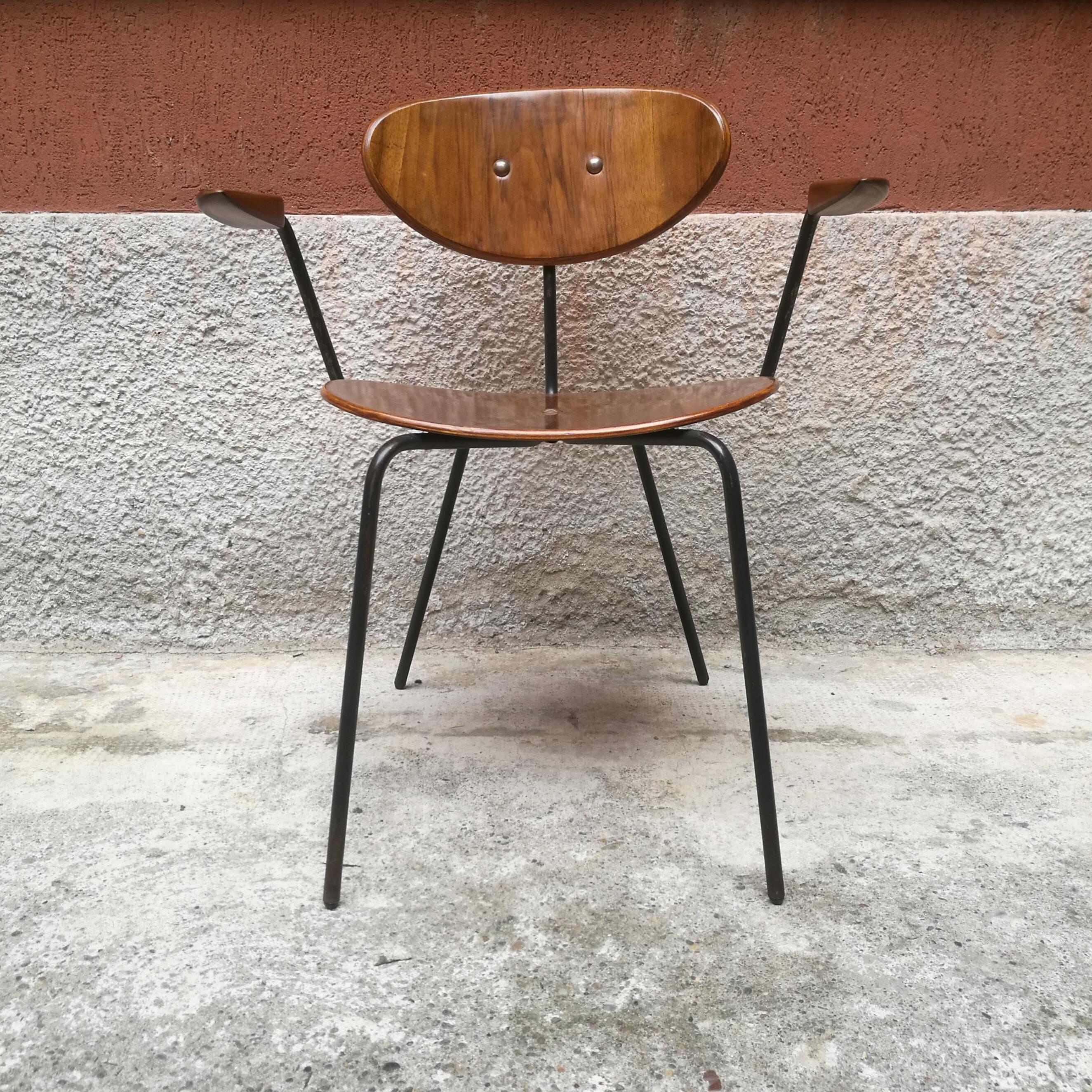 Teak chair with armrests from Germany, 1960s
German unique chair from 1960s, made in teak and metal. Seats and armrests are in teak, while the structure is in black metal thin rod. Absolutely stunning presence, on a piece that can live alone or