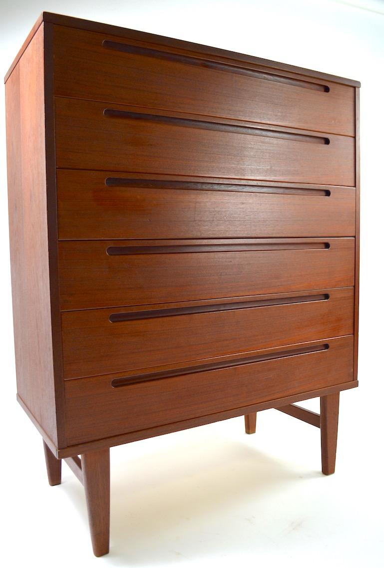 Classic Danish modern teak dresser designed by Nils Jonsson for HJN Mobler. The chest features 6 drawers ( interior dimensions 33 inch W x 4.25 inch H). Solid wood construction, very good original condition showing only light cosmetic wear, normal