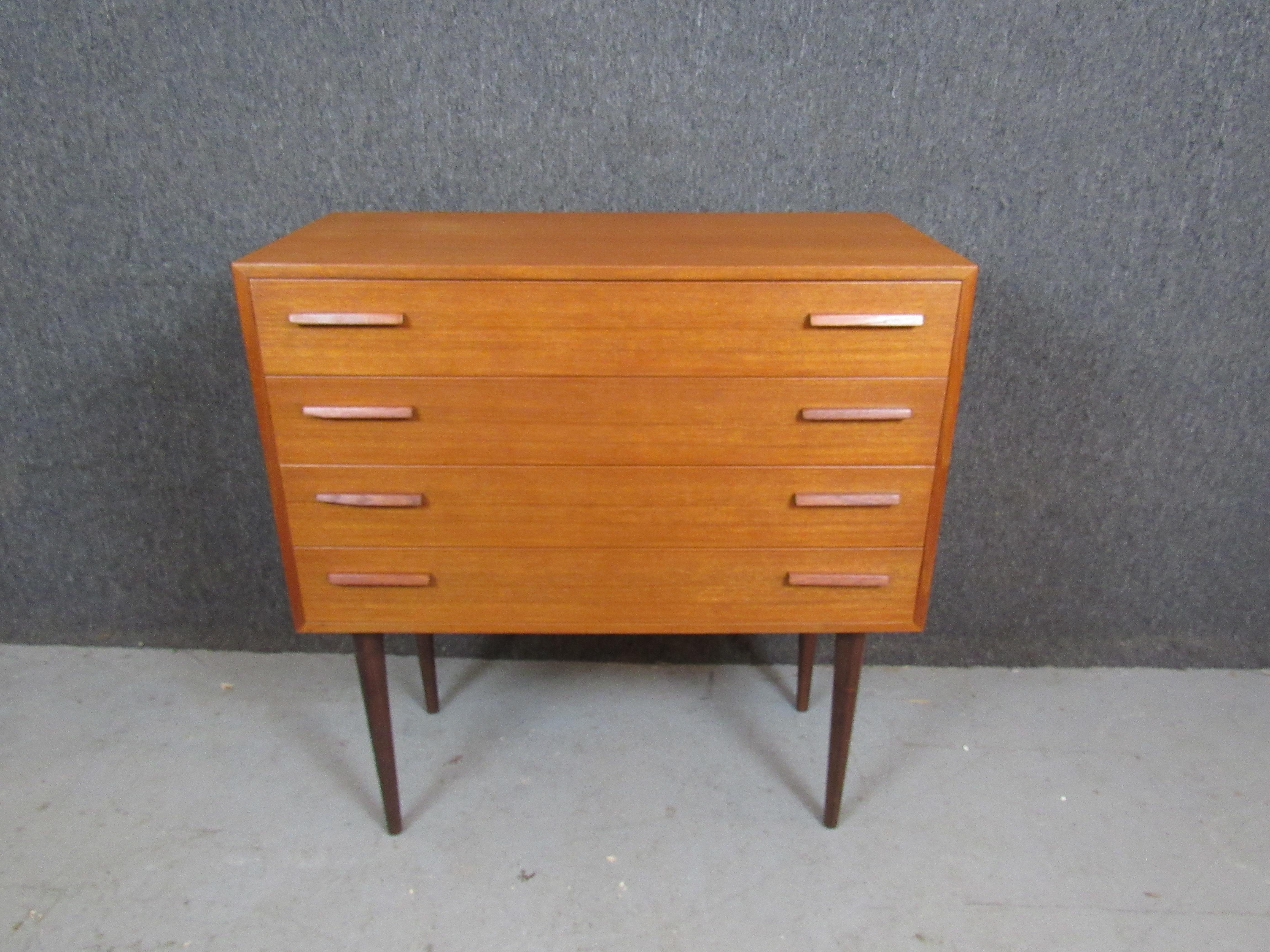 Don't miss out on your chance at a truly one-of-a-kind piece from one of the most respected names in mid-century Scandinavian modern design! This stunning chest of drawers designed by Kai Kristiansen himself features an extraordinary teak grain that