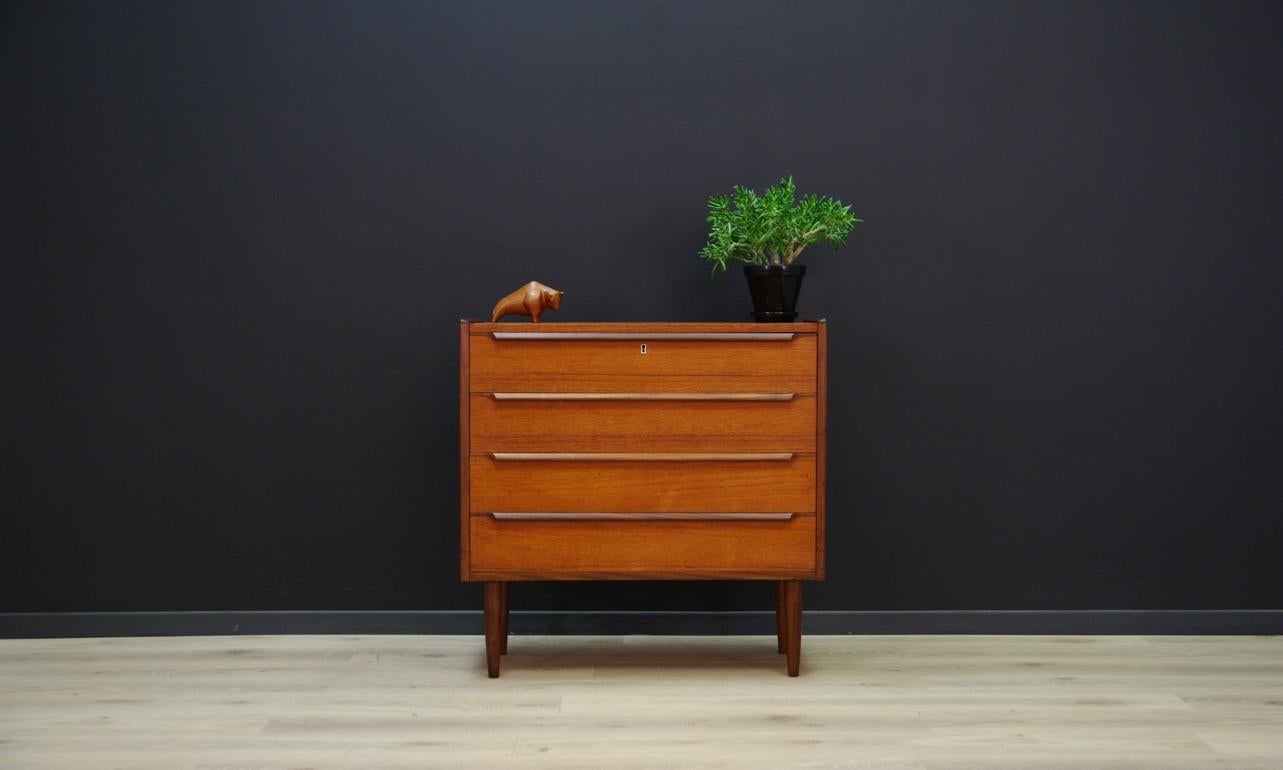 Fantastic chest of drawers from the 1960s-1970s - Scandinavian design. Furniture covered with teak veneer. Four capacious drawers. No key in the set. Preserved in good condition (small bruises and scratches) - directly for use.

Dimensions: Height