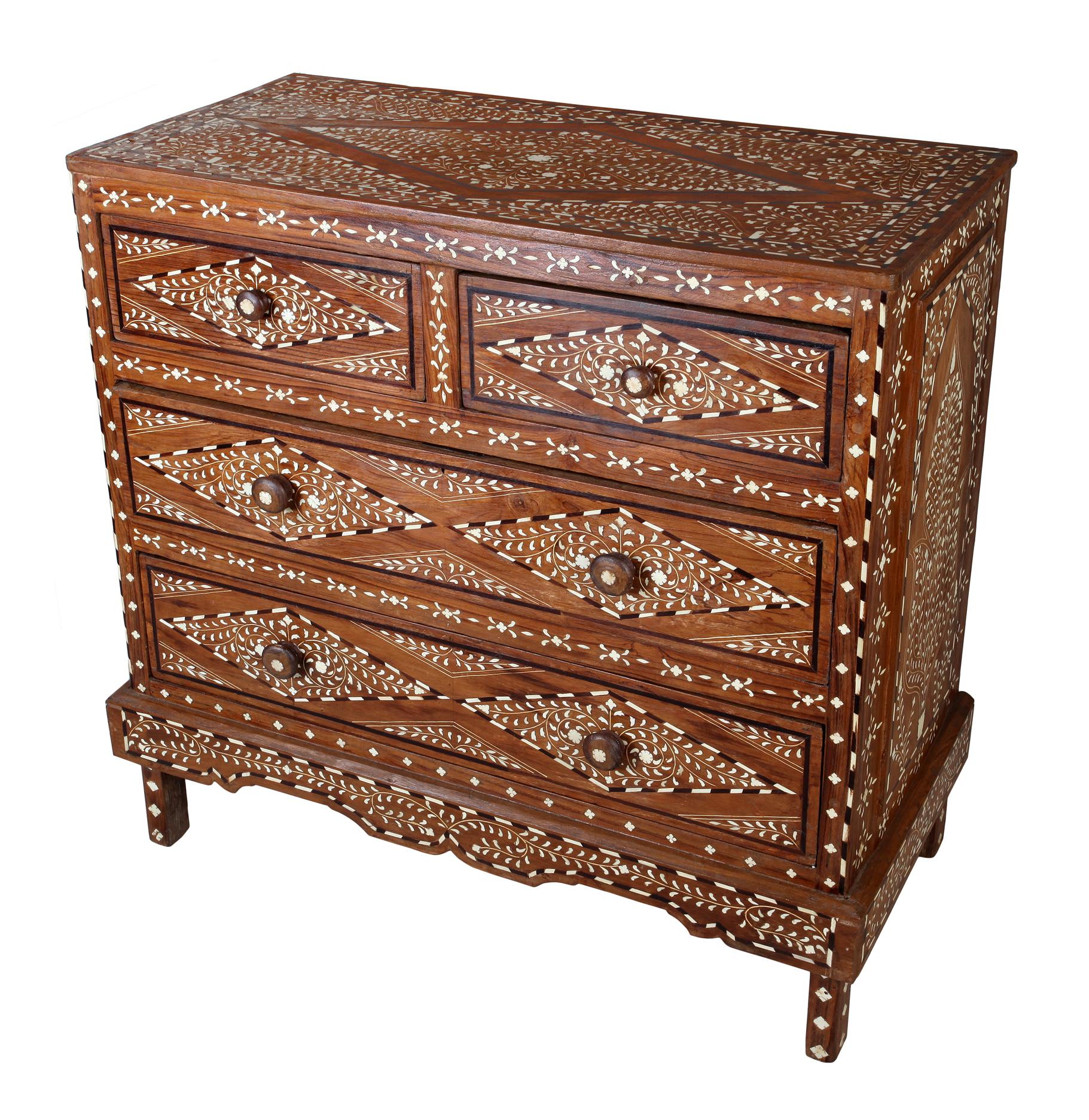 Mid-20th century teak chest of drawers with bone and rosewood inlay on all three sides and top. Intricate and finely detailed turned round drawer pulls also with inlay at the center. A nice combination of geometric and floral patterns. Straight