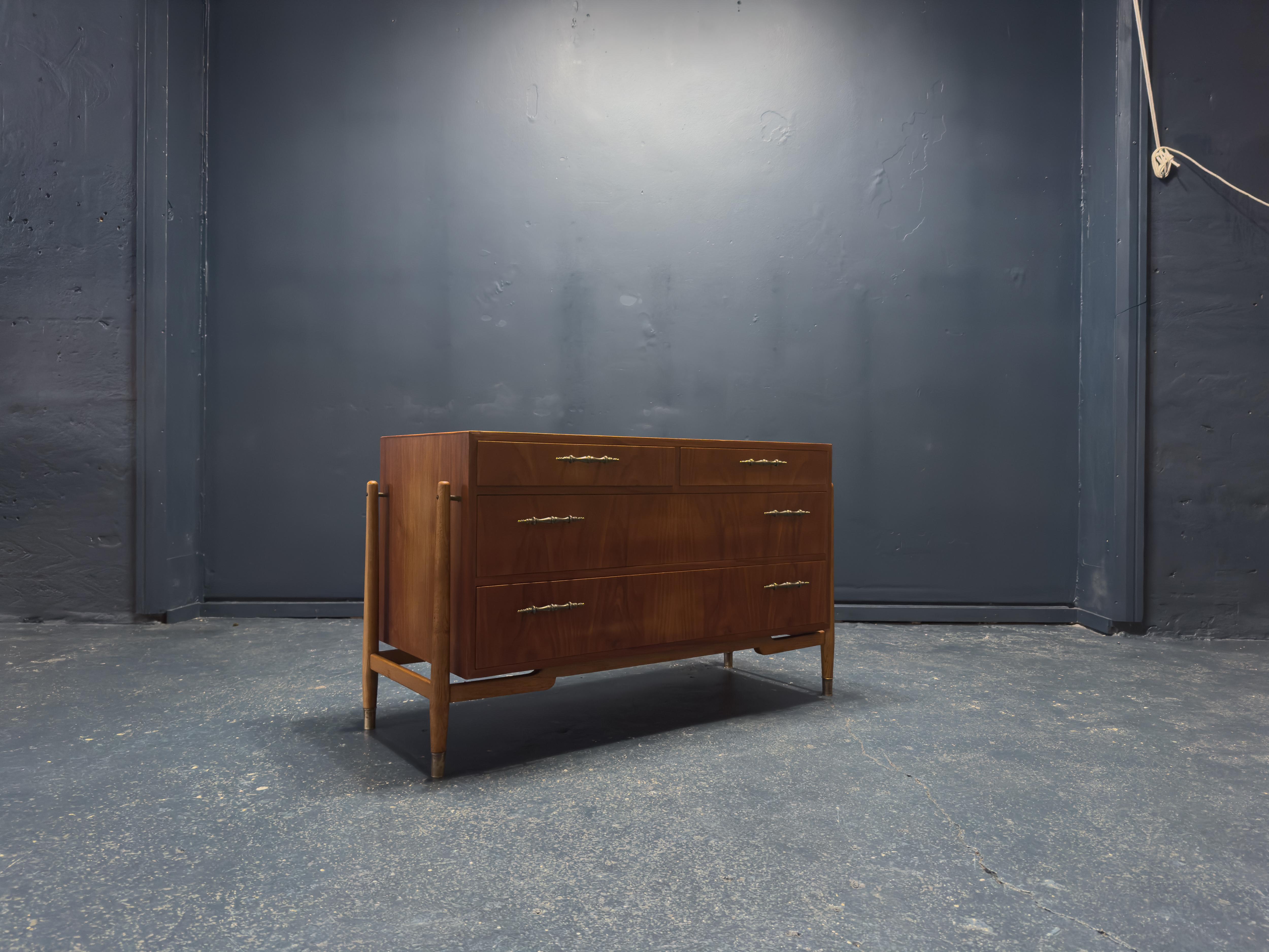 This mid-century teak chest of drawers is a stunning example of elegant design, craftsmanship, and functionality, embodying the best of 1950s Scandinavian modernism. Crafted from richly grained teak, the chest showcases a warm, lustrous finish that