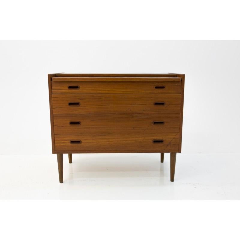 Mid-Century Modern chest of drawers, comes from Denmark from around 1960s-1970s.
In comparison to others, this one has an extra shelf with compartments for jewelry/cosmetics or other small objects. Preserved in good condition, it's put under the