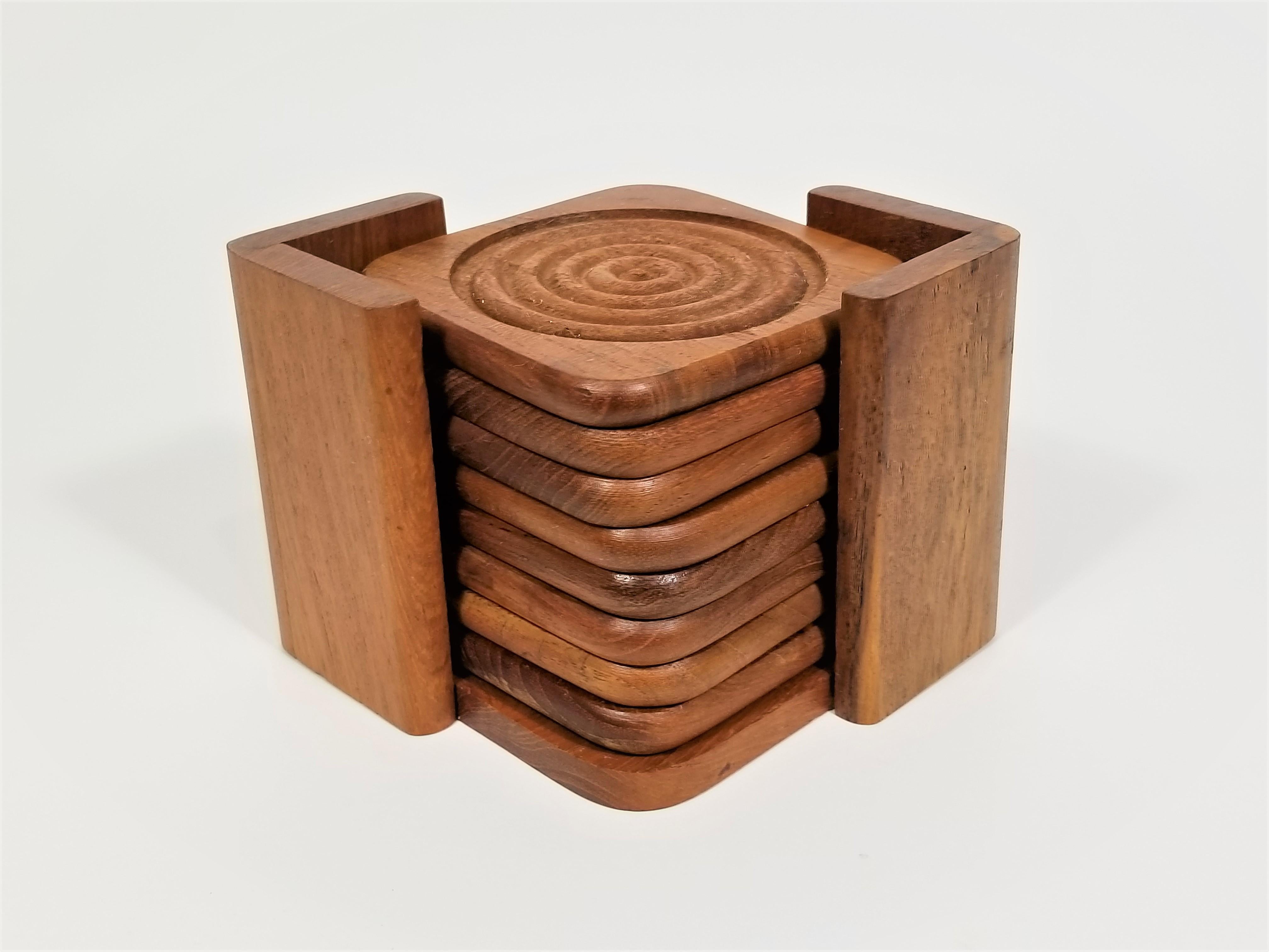 Mid century 1960s teak coasters with holder. Set of 8.