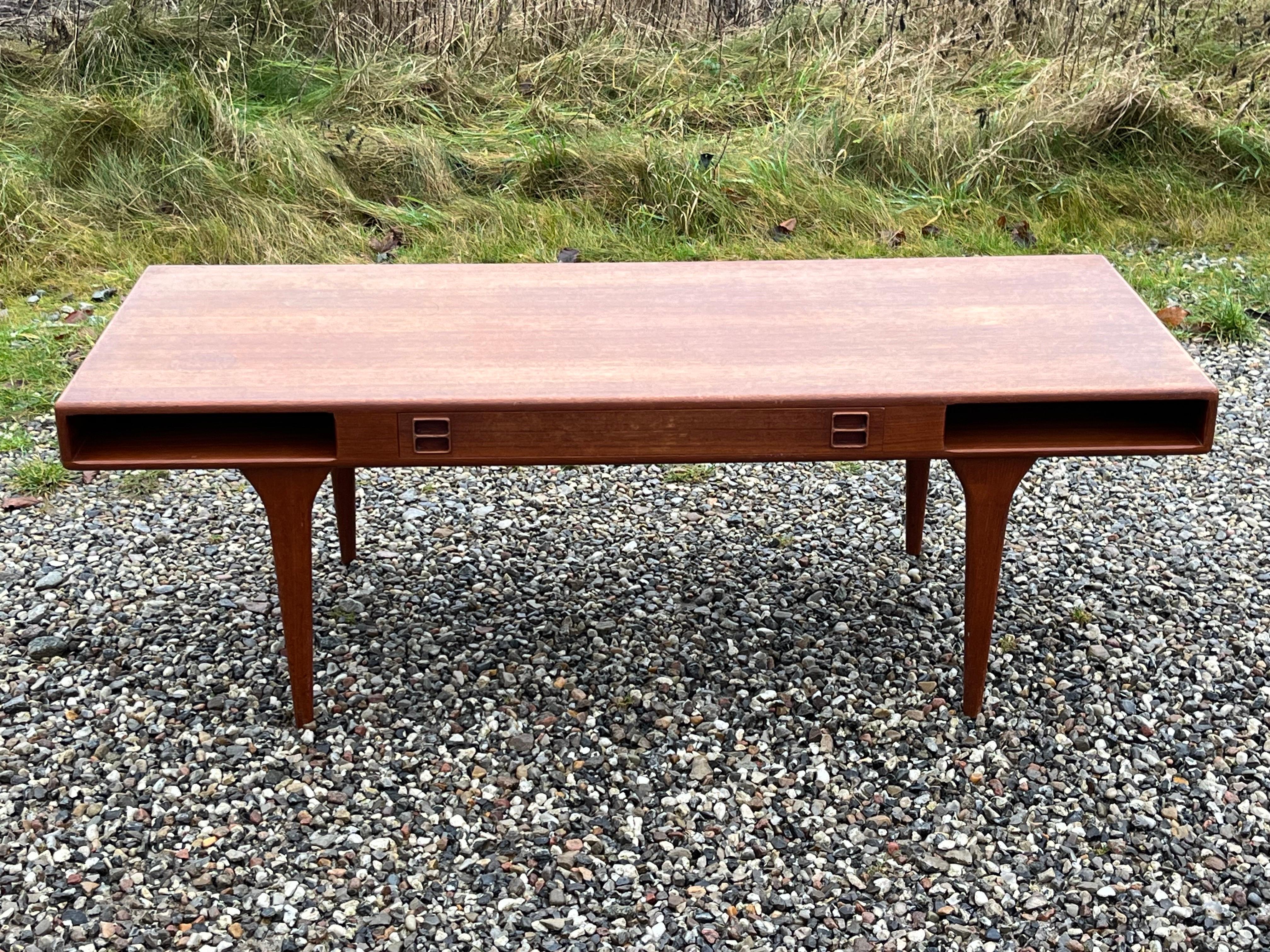 Johannes Andersen. Teak coffee table, frame with drawers and compartments, tapered legs. Manufactured at CFC Silkeborg. Model 286. H. 50 L. 150 W. 60 cm.