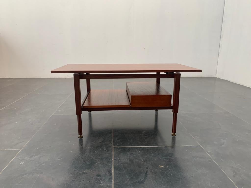 Teak coffee table with drawer and brass details, 1960s.