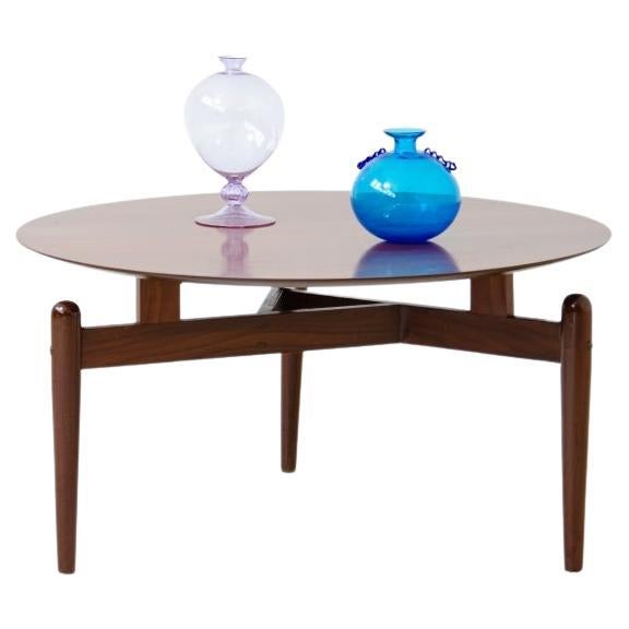 Teak coffee table with suspended top For Sale