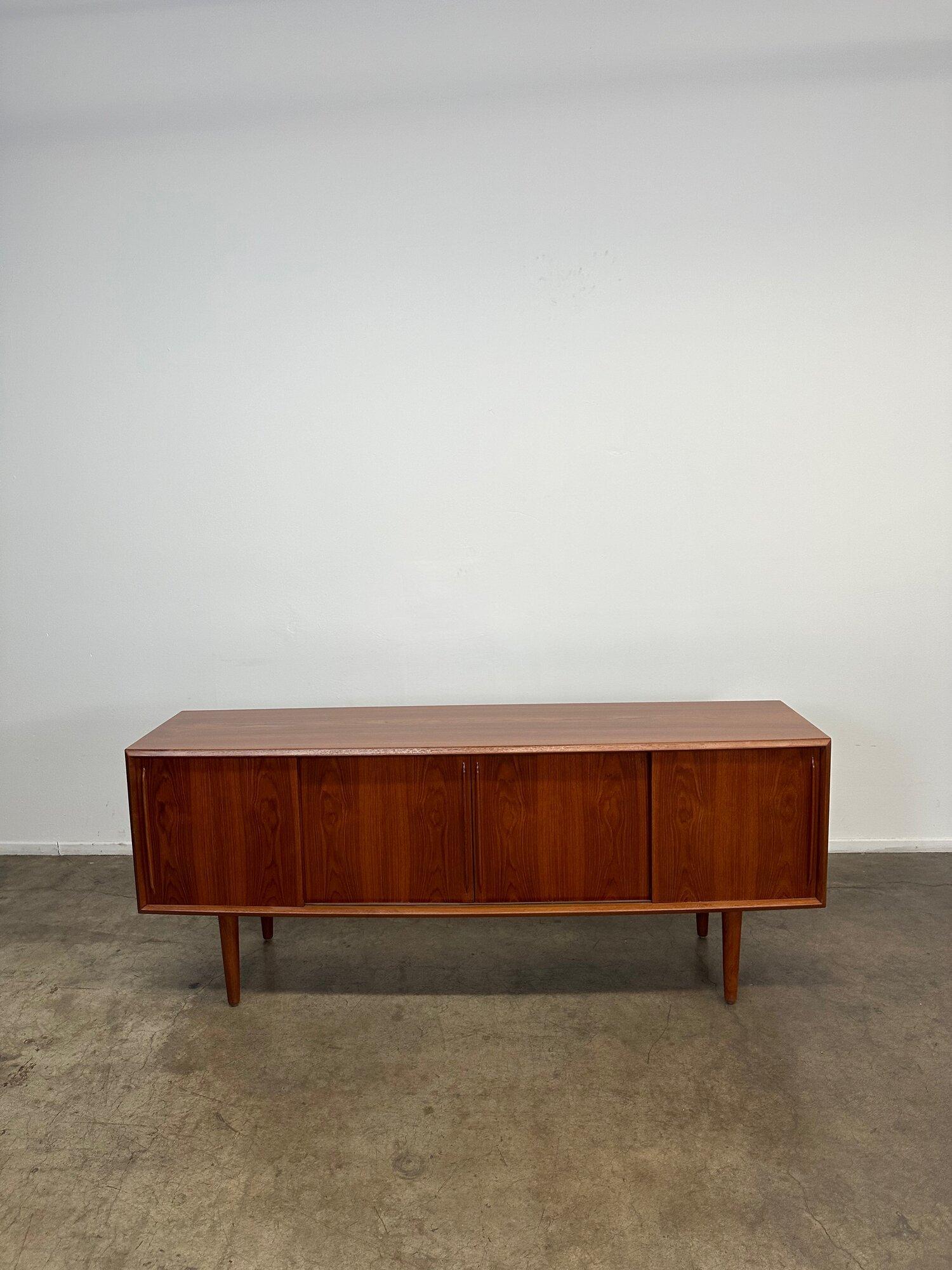 Fully restored teak credenza in excellent condition. This item has been inspected by our in house carpenters and fully refinished. Item is structurally sound and aesthetically shows well. 
