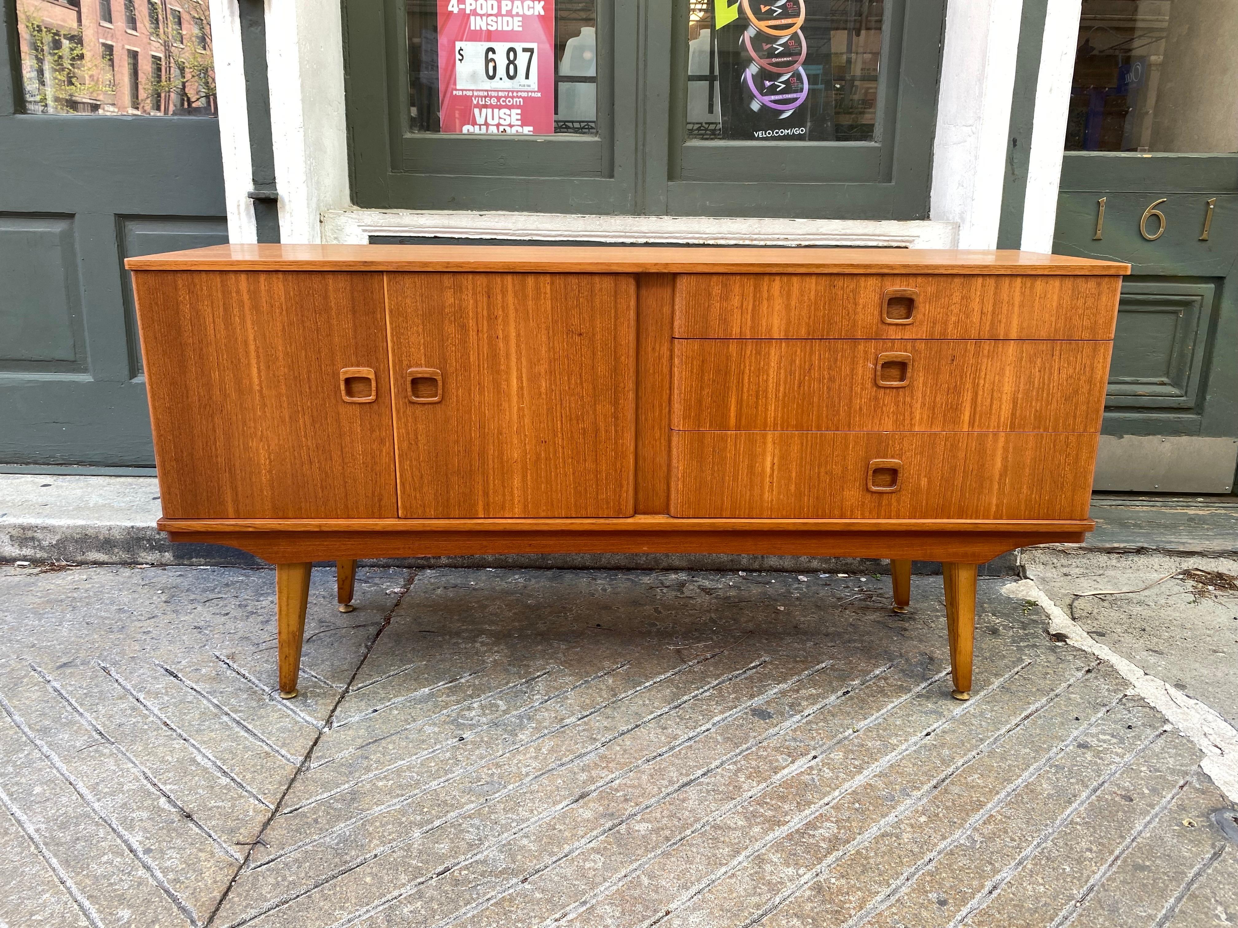 Teak Credenza or buffet. Nice scale and size! Measures 59.5 wide, 29.5 high and 17