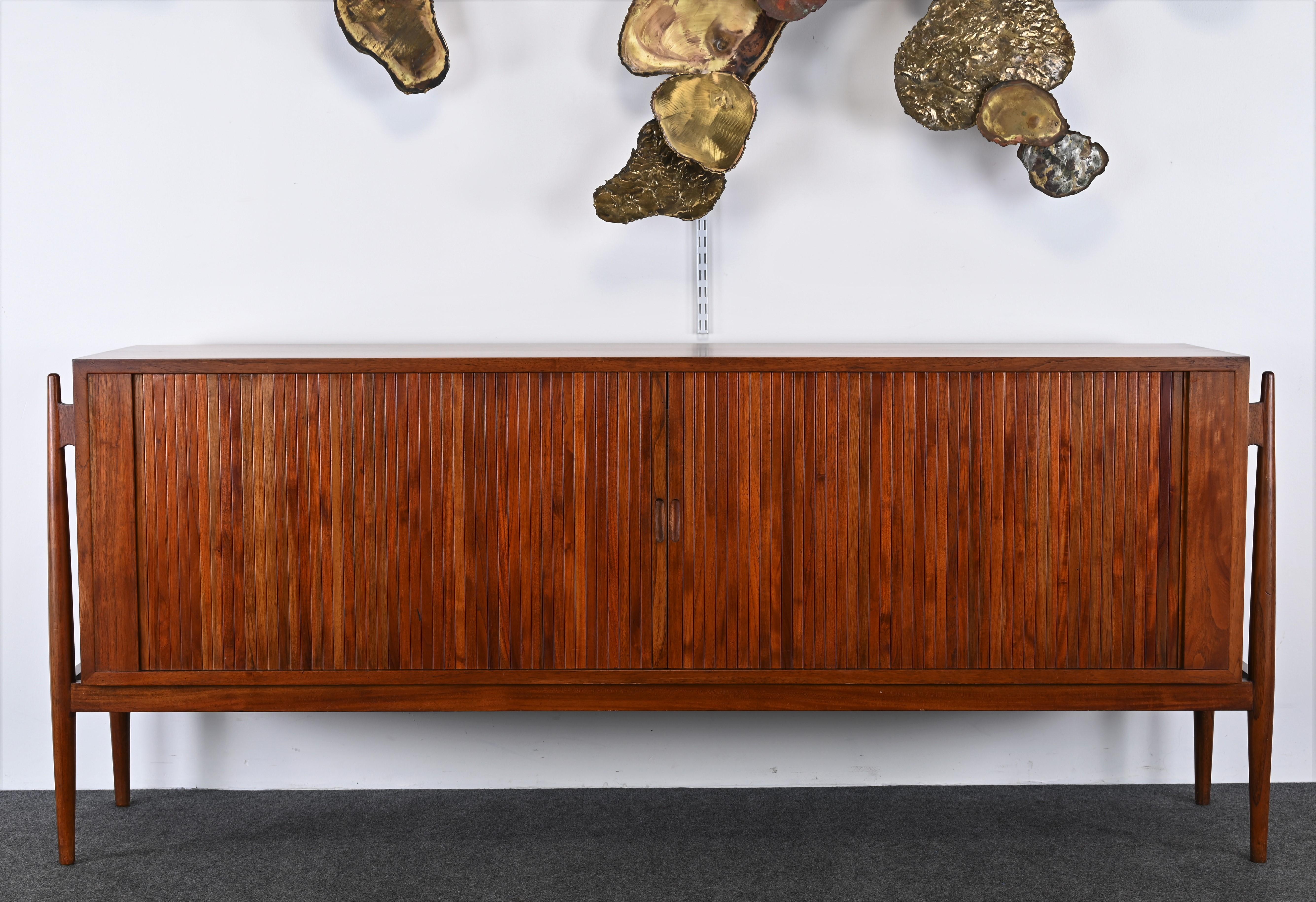 A beautiful Teak Credenza in the manner of Finn Juhl. Great modern lines and simple design. This sideboard is of Asian manufacture but looks very much like the original produced in the 1960s but at a fraction of the price. Would look great in a