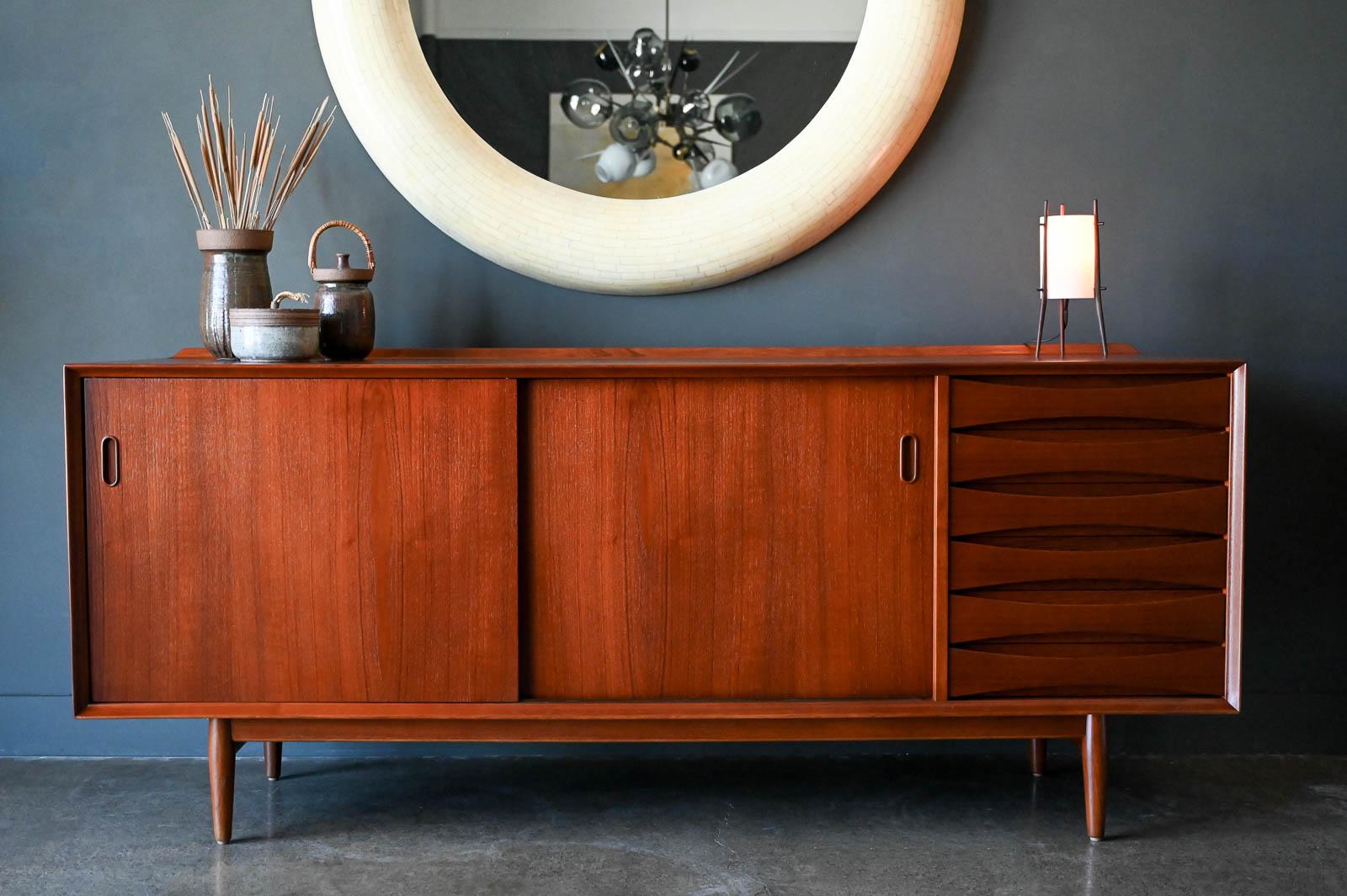 Teak Credenza Model 29 by Arne Vodder for Sibast Furniture, circa 1960. Professionally restored in showroom condition, this beautiful model PD 29 credenza for Povl Dinesen for Sibast Furniture, was designed by Arne Vodder. Beautiful teak grain,