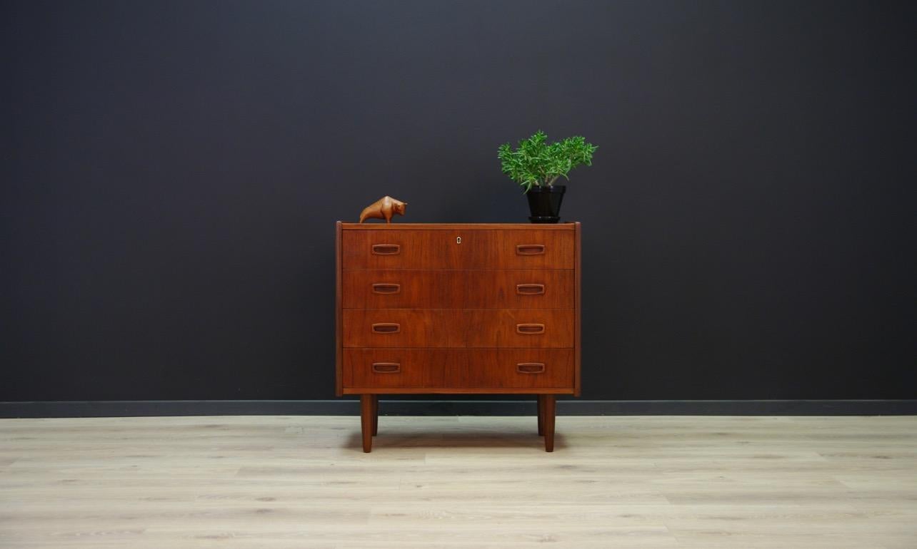 Classic chest of drawers from the 1960s-1970s, minimalist form, Danish design. The whole veneered with teak. Item has four capacious drawers. No key. Preserved in good condition (small bruises and scratches) - directly for use.

Dimensions: Height