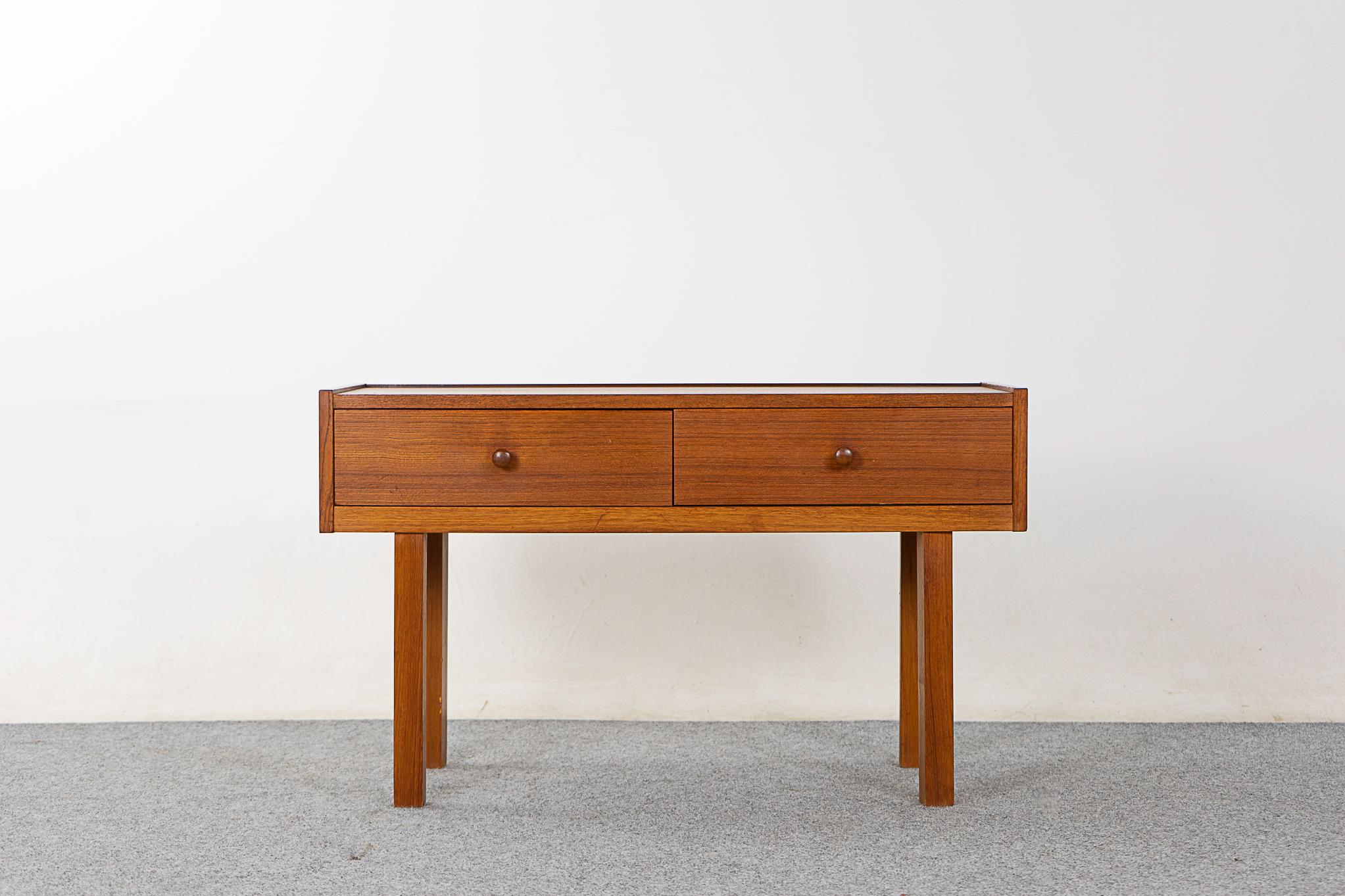 Teak mid-century bedside table, circa 1960's. Nice compact size with beautifully veneered case and slender legs. 