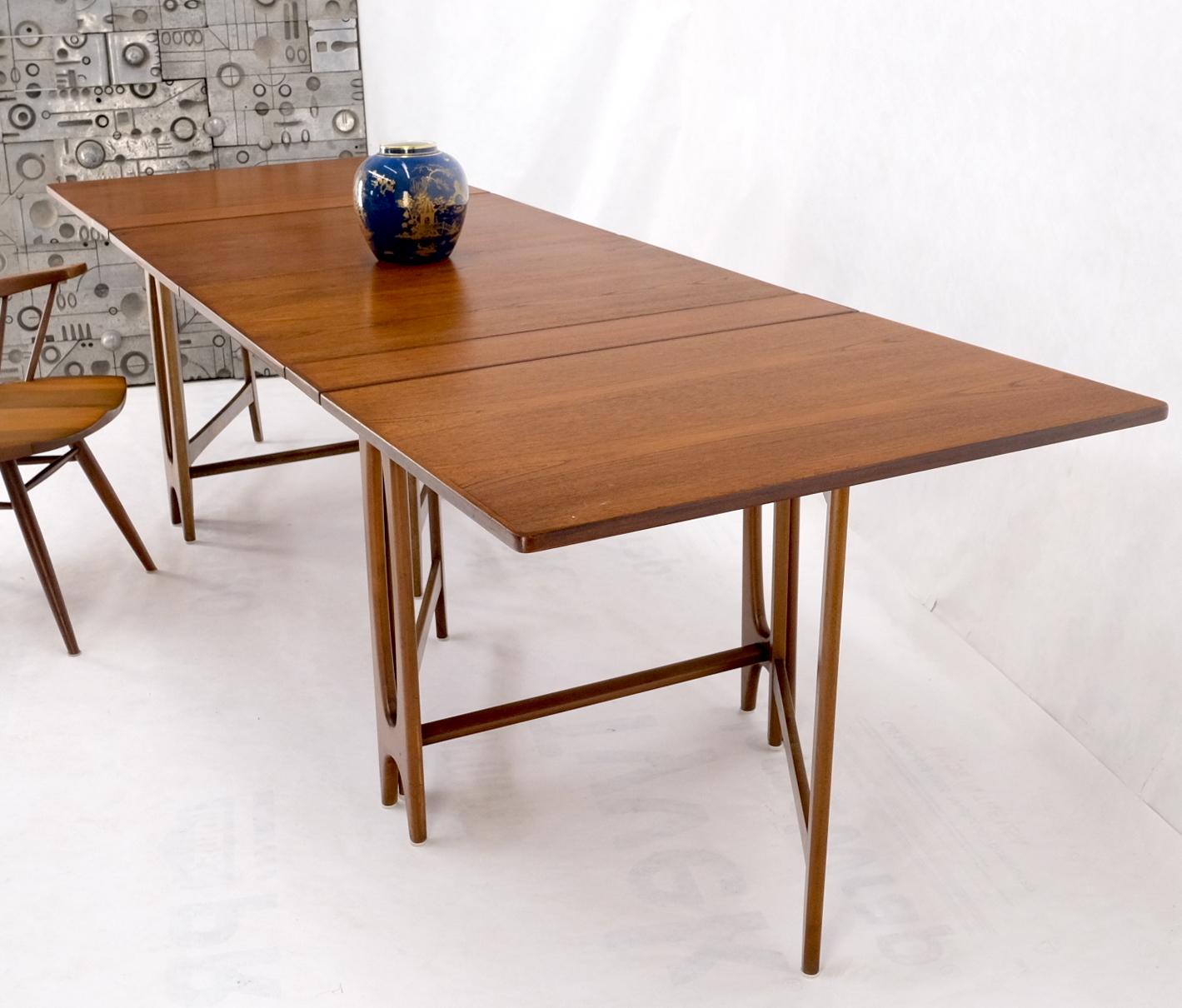 Teak Danish Mid-Century Modern Banquet dining gate leg drop Leaf Maria Table 2pcs MINT!
This is a two separate pieces version that can be interconnected into one long table.
Folded dimensions: 35×16×29.