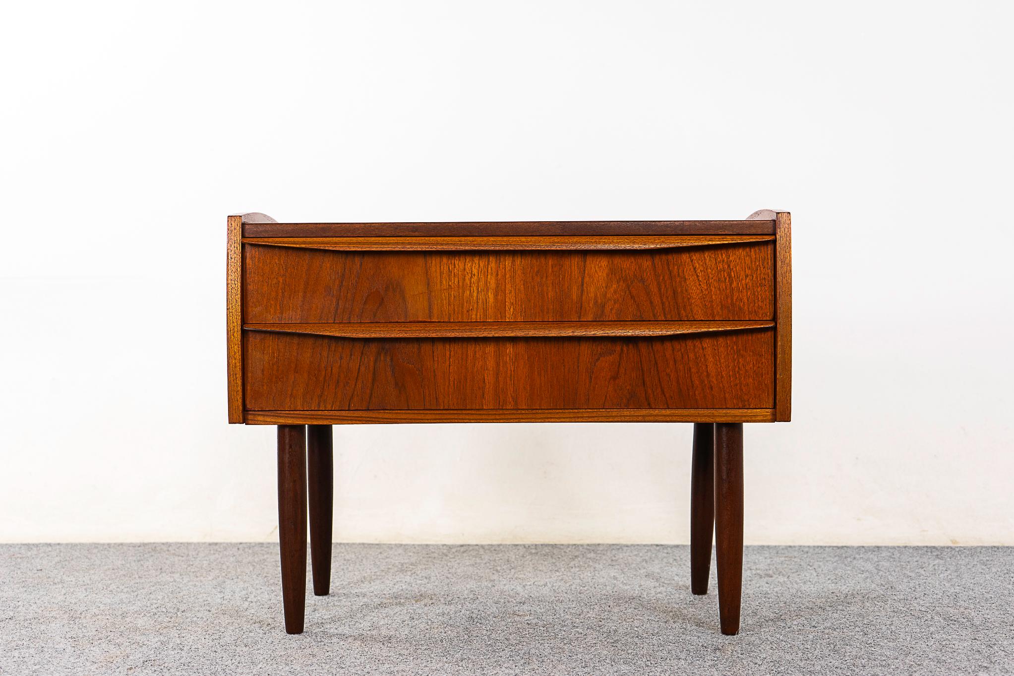 Teak mid-century bedside table, circa 1960's. Beautifully veneered case, tapered legs, dovetailed drawers and lovely graining.