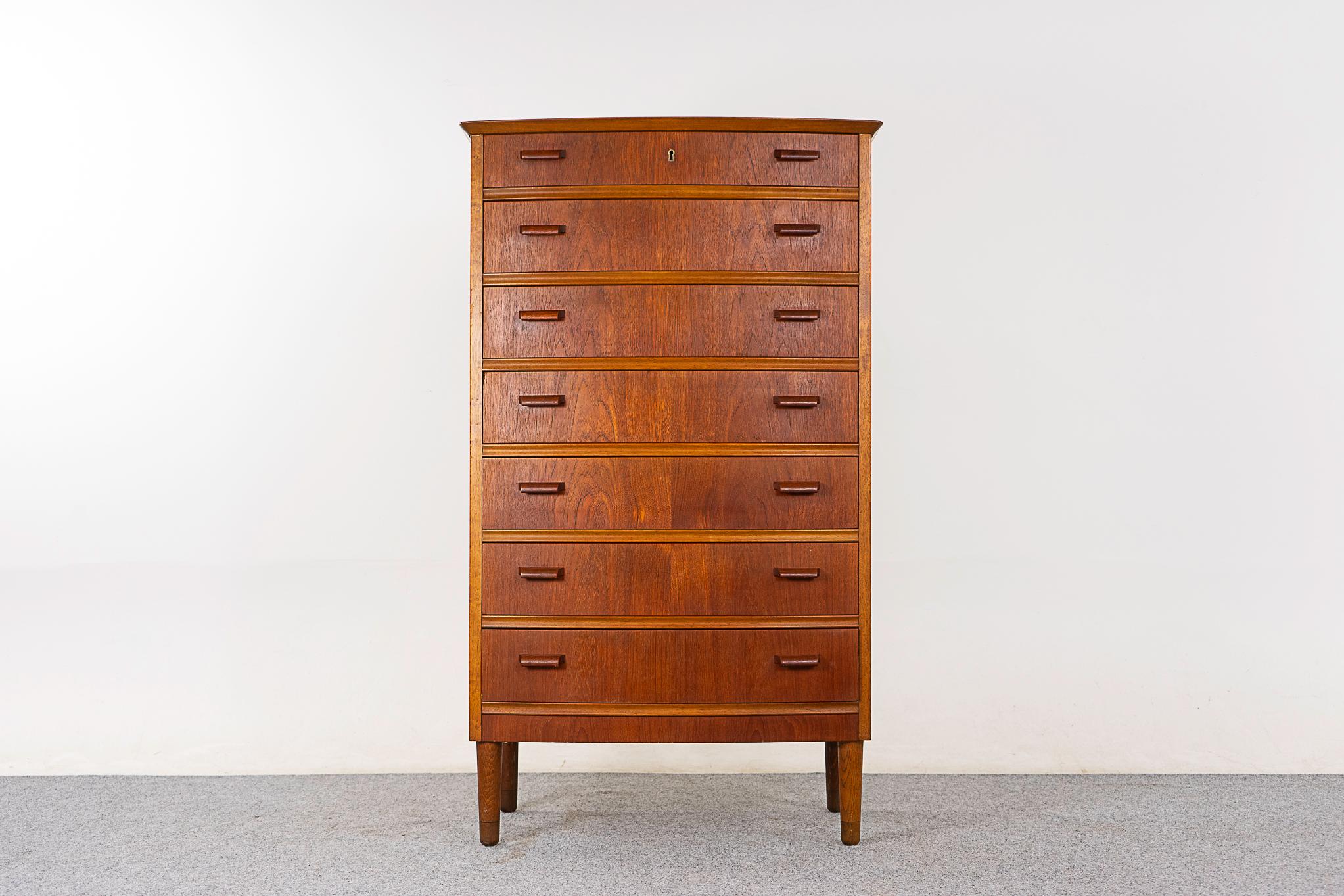 Teak Danish dresser, circa 1960's. Elegant gentle curved front with solid wood edging and stunning book-matched veneer drawer faces. 

Unrestored item with option to purchase in restored condition for an additional $200 USD. Restoration includes: