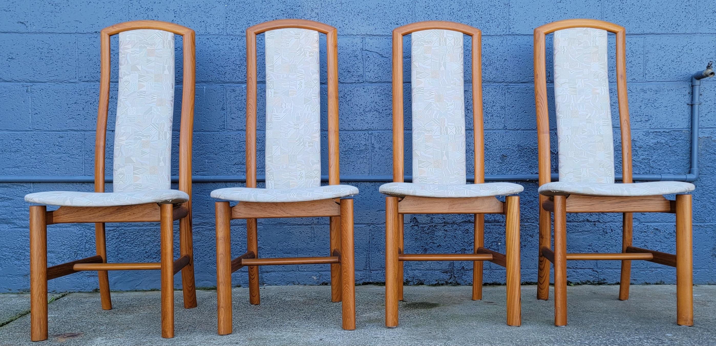 A quality set of 4 teak Danish Modern dining chairs by Skovby Mobelfabrik, Denmark. Classic floating seat design. Curvaceous high-back design offers extreme comfort. Substantial solid teak construction.