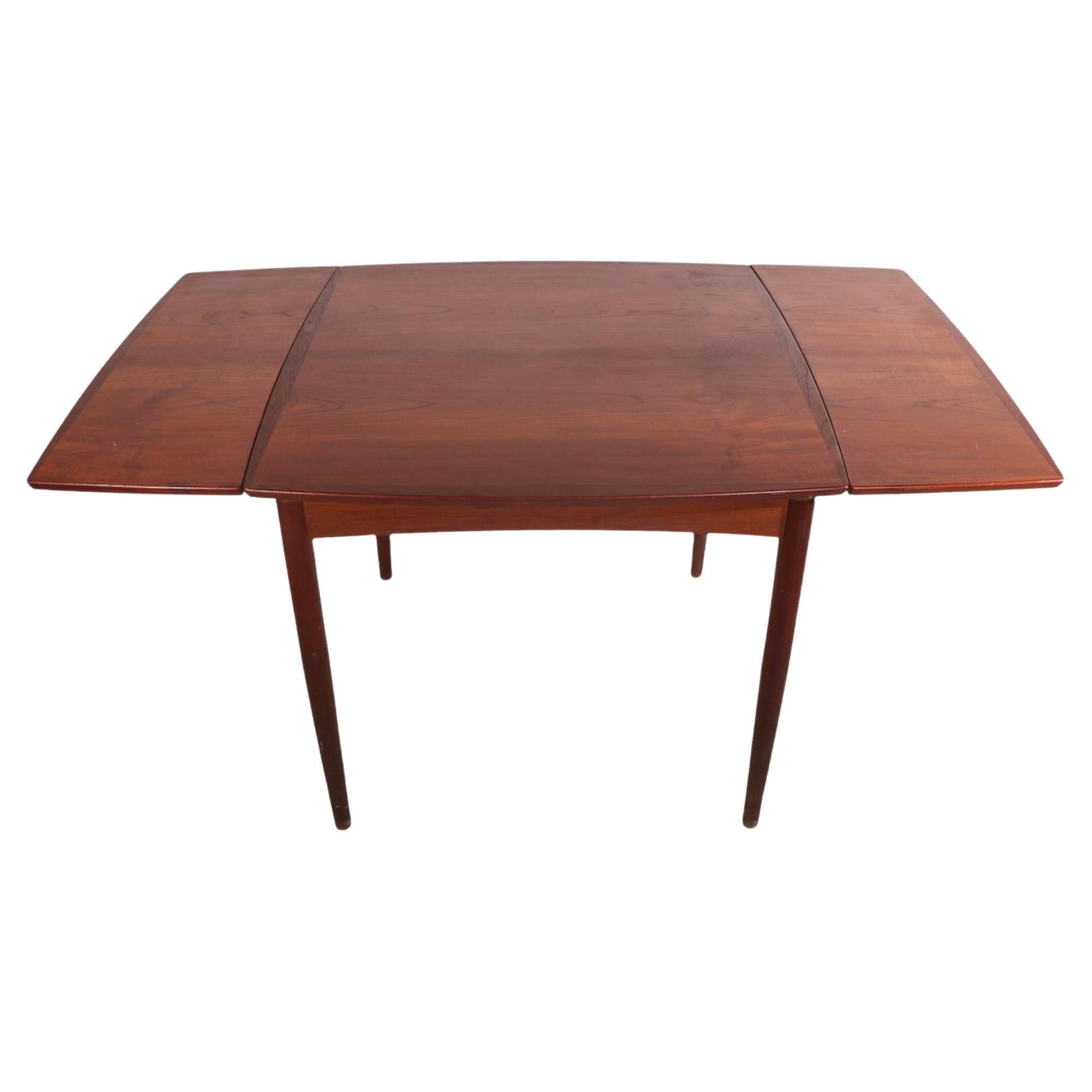 Danish Modern Teak Dining Table With Two Pullout Leaves at 1stDibs