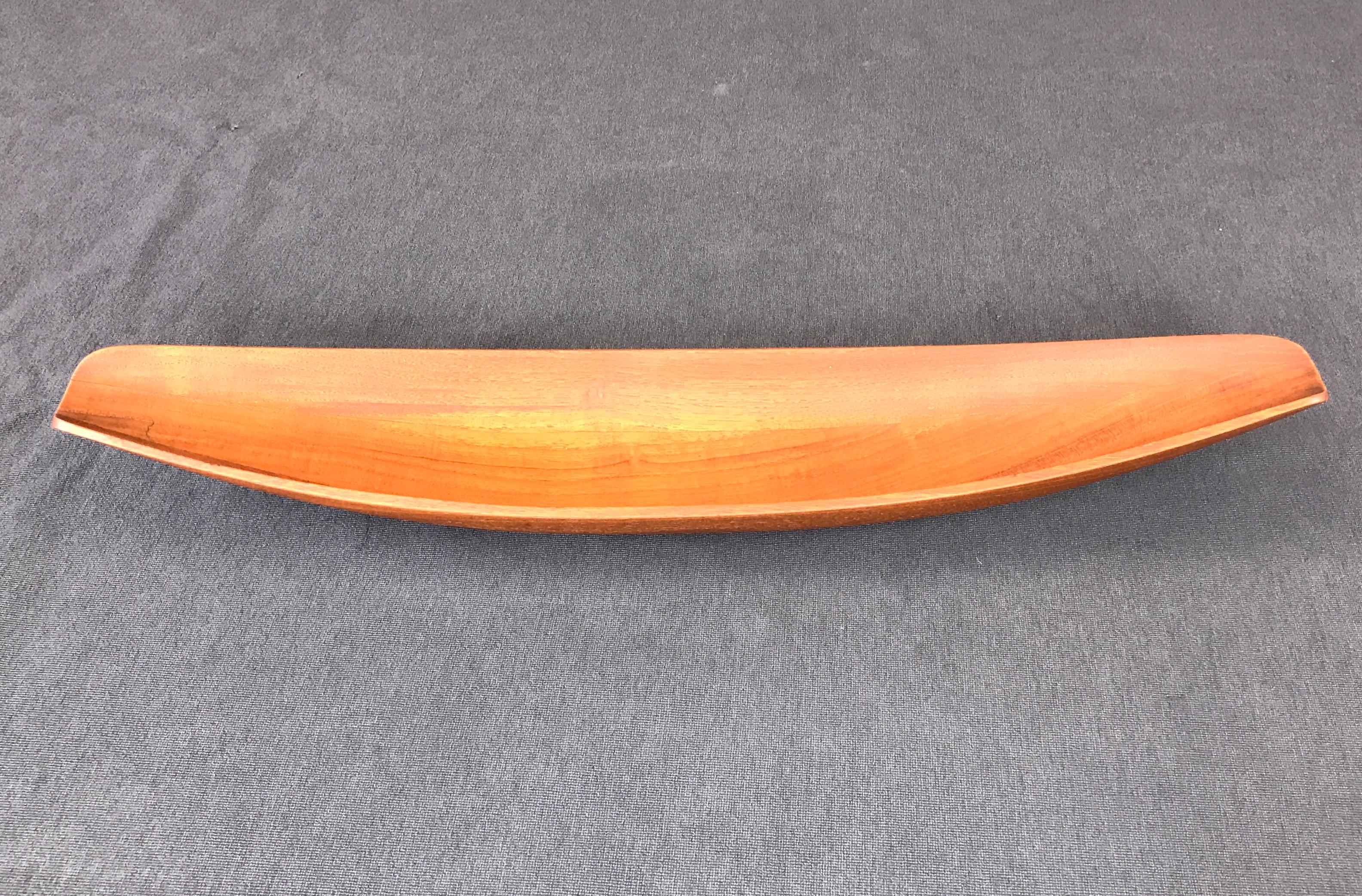 A large teak canoe bowl designed by Jens Quistgaard, for Dansk, circa 1950s.