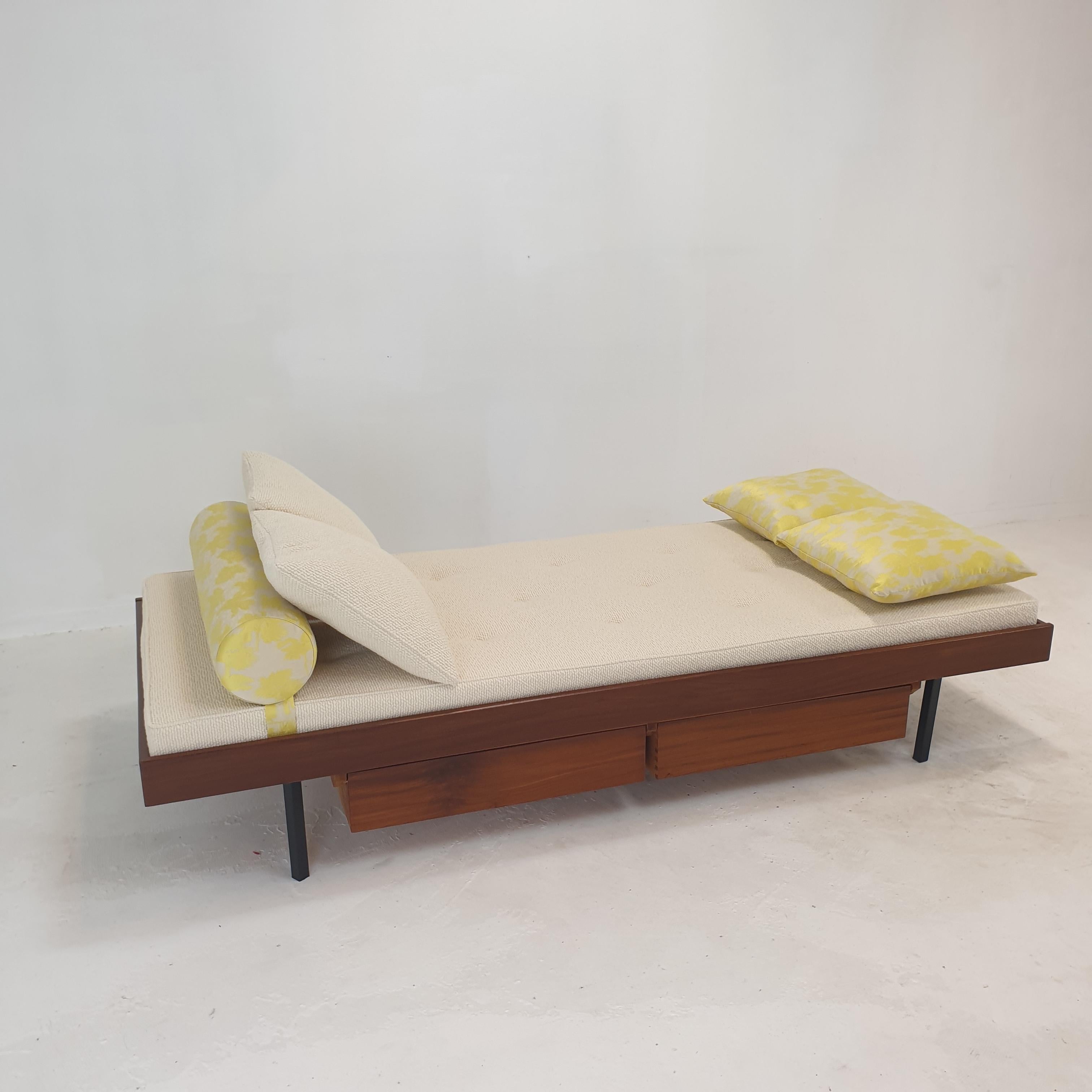 Very nice teak daybed, fabricated in The Netherlands in the 60's. 
Underneath the bed there are two drawers.

The mattress is renewed with new foam and it has just been upholstered with lovely wool fabric, the same for two cushions.

The