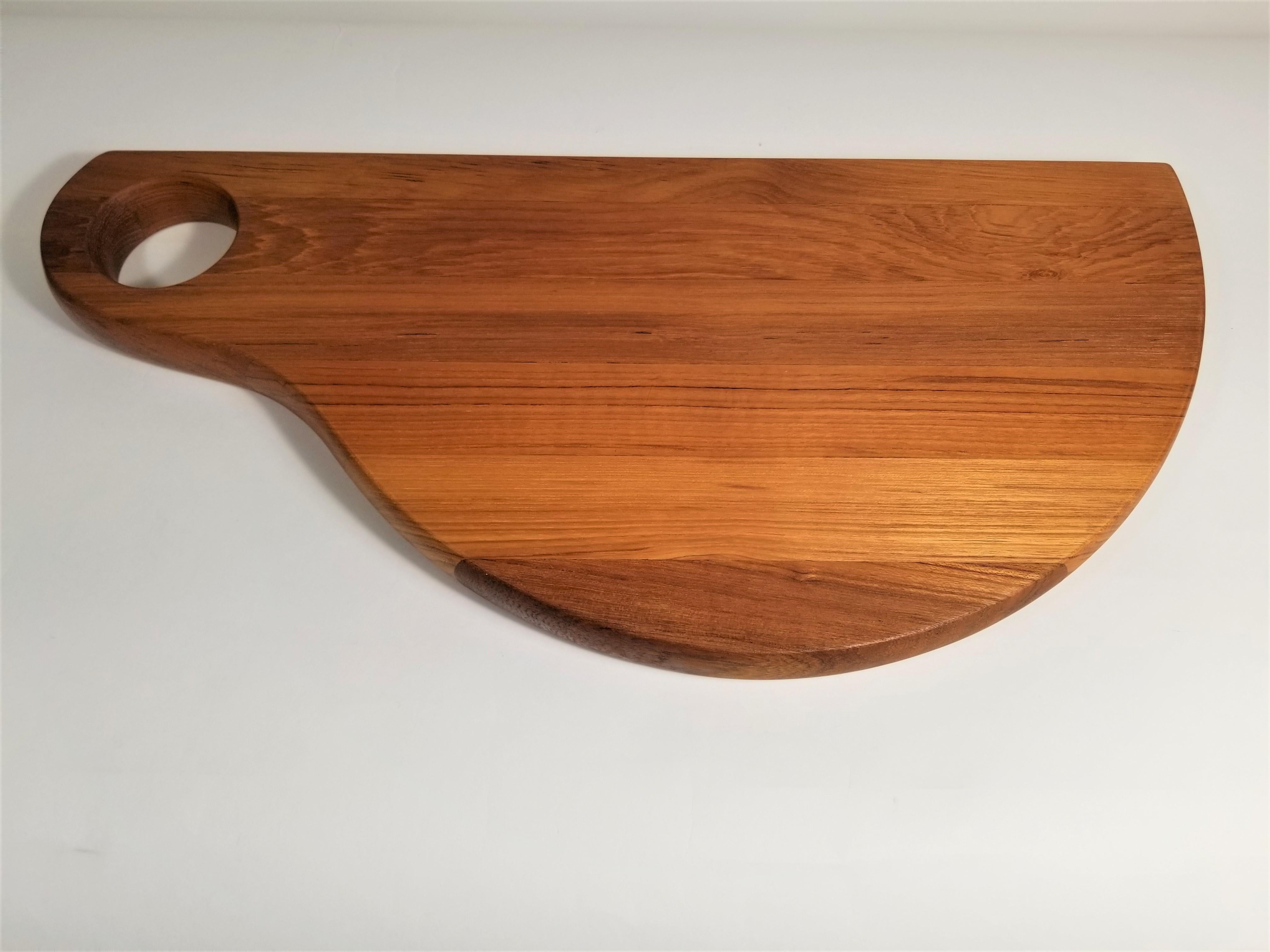 Mid Century Late 1960s-early 1970s Danish Teak Tray or cutting board perfect for Charcuterie. Unused and still with original box and plastic wrapping. 
Marked Denmark.