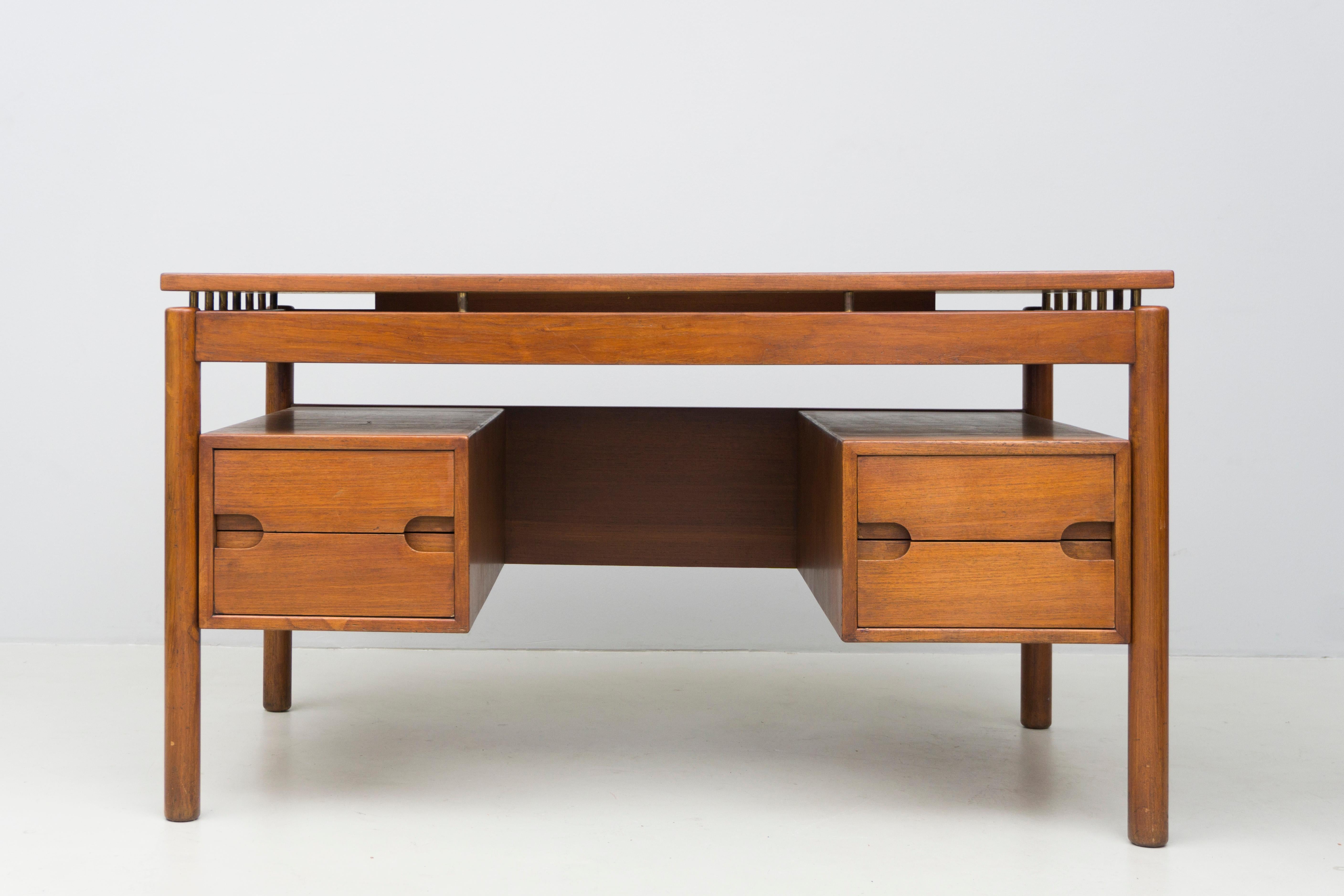 Ilmari Tapiovaara (1914-1999), a Finnish interior architect and designer, designed this desk around 1960 for ‘La Permanente di Cantú’.
Made from solid teak with brass details. The desk has two drawers.