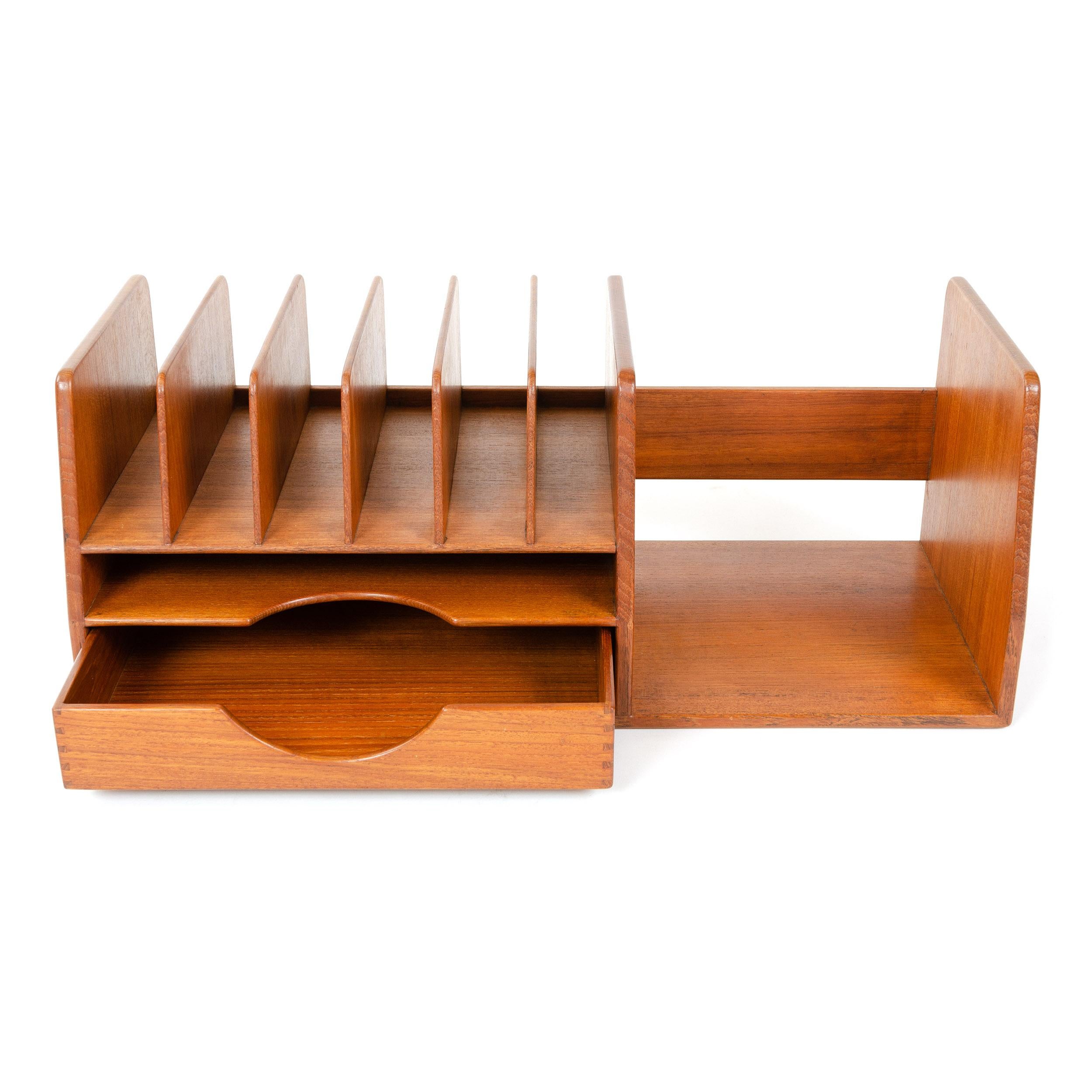 A bench-made solid teak desk organizer with dovetail joinery, comprising five correspondence dividers, a slim drawer and open storage.