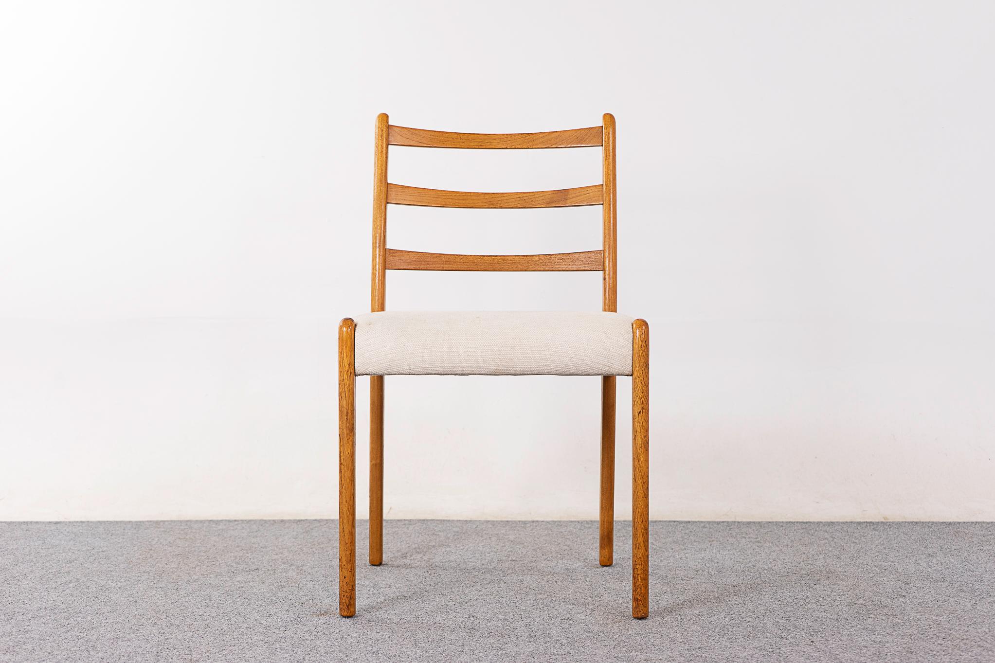 Teak mid-century dining chair, circa 1960's. Beautifully slatted backrests and generous seat.

Unrestored item with option to purchase in restored condition for an additional $100 USD. Restoration includes: repairs, sanding, staining and an oil