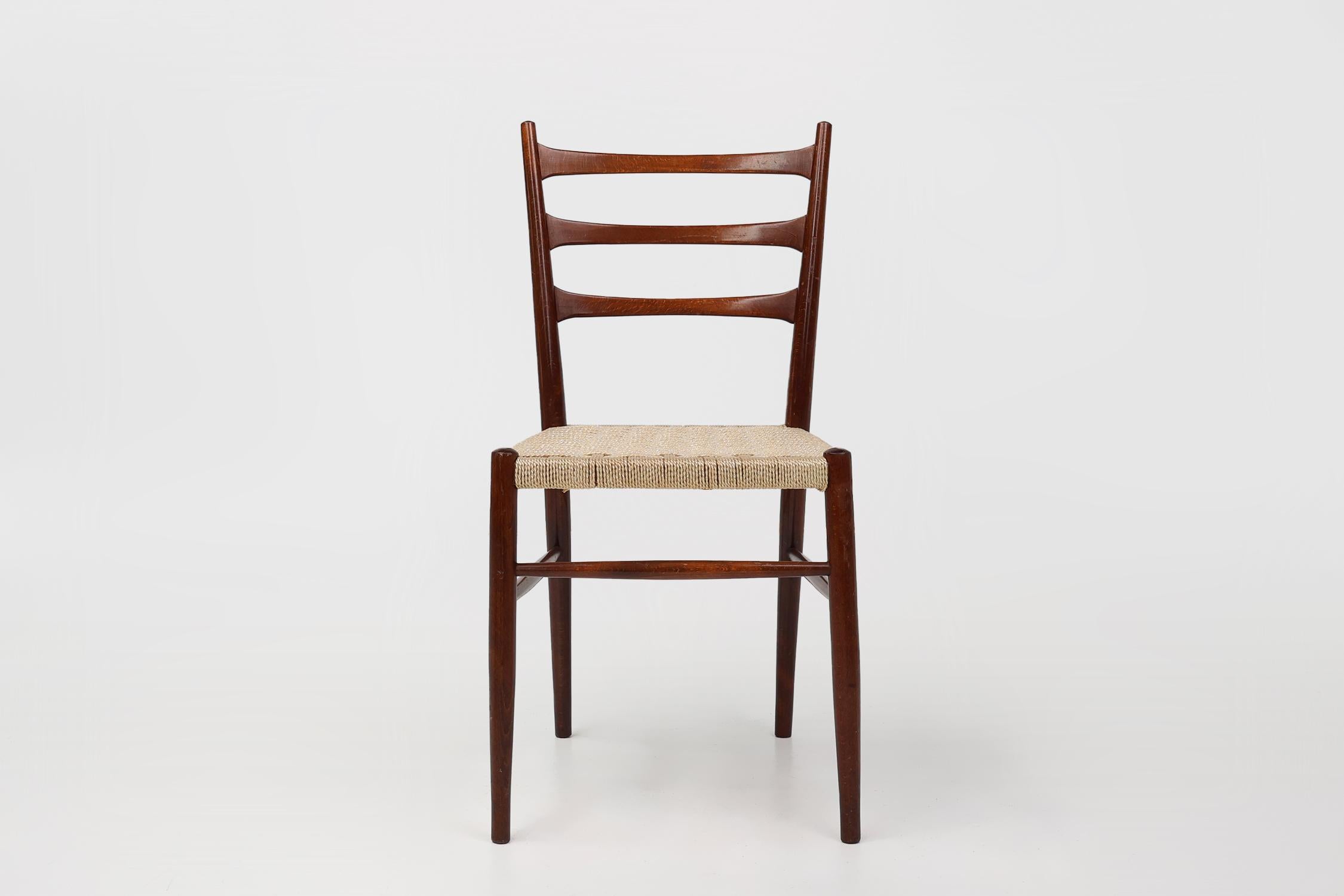 Belgium / 1960 / 2 chairs / teak / mid-century / vintage

Beautifully designed teak dining chairs with curved back with bars, slender legs and braided rope seat. The teak wood frame has a fragile, yet highly graceful expression. The four cylindrical