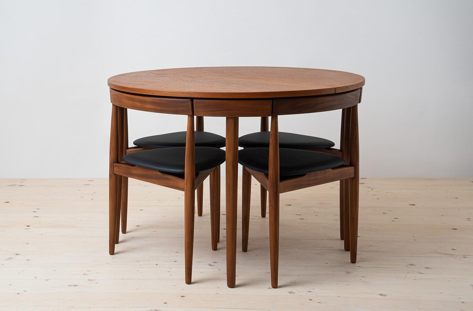 Rare “Roundette” dining set originally designed by Hans Olsen in 1952 for Frem Røjle this dining set has since become an icon of classic Danish Mid Century Modern design. This gorgeous dining set features an extendable teak wood round table and four